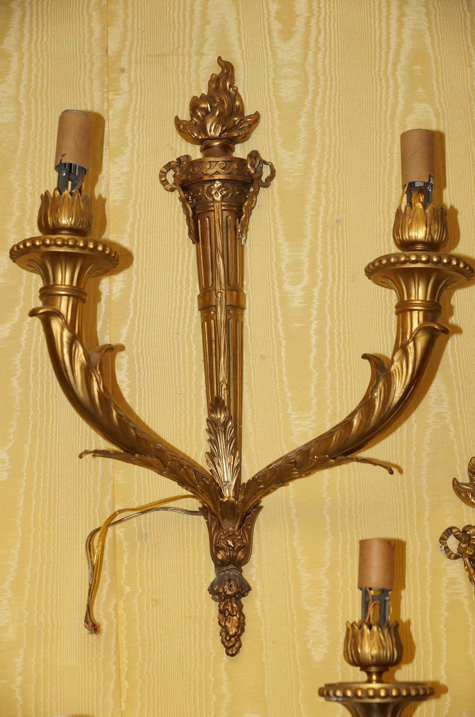 Pair of two-light torch-form sconces in the Louis XV style, with sockets and wiring, ready for use.