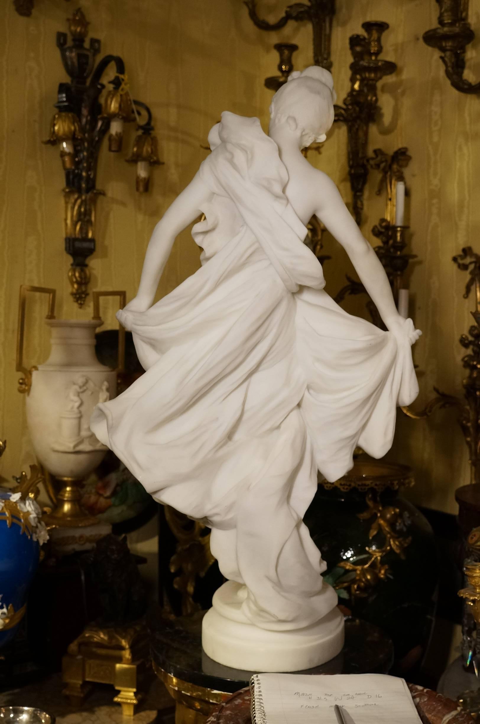 A fantastic carved Italian white marble figure of a standing semi nude maiden showing off her dress.
Signed: Prof A. Biggi Carrara 1896.

Alessandro Biggi, born in Carrara, Italy in 1848, was an Italian sculptor, professor, and politician. Many