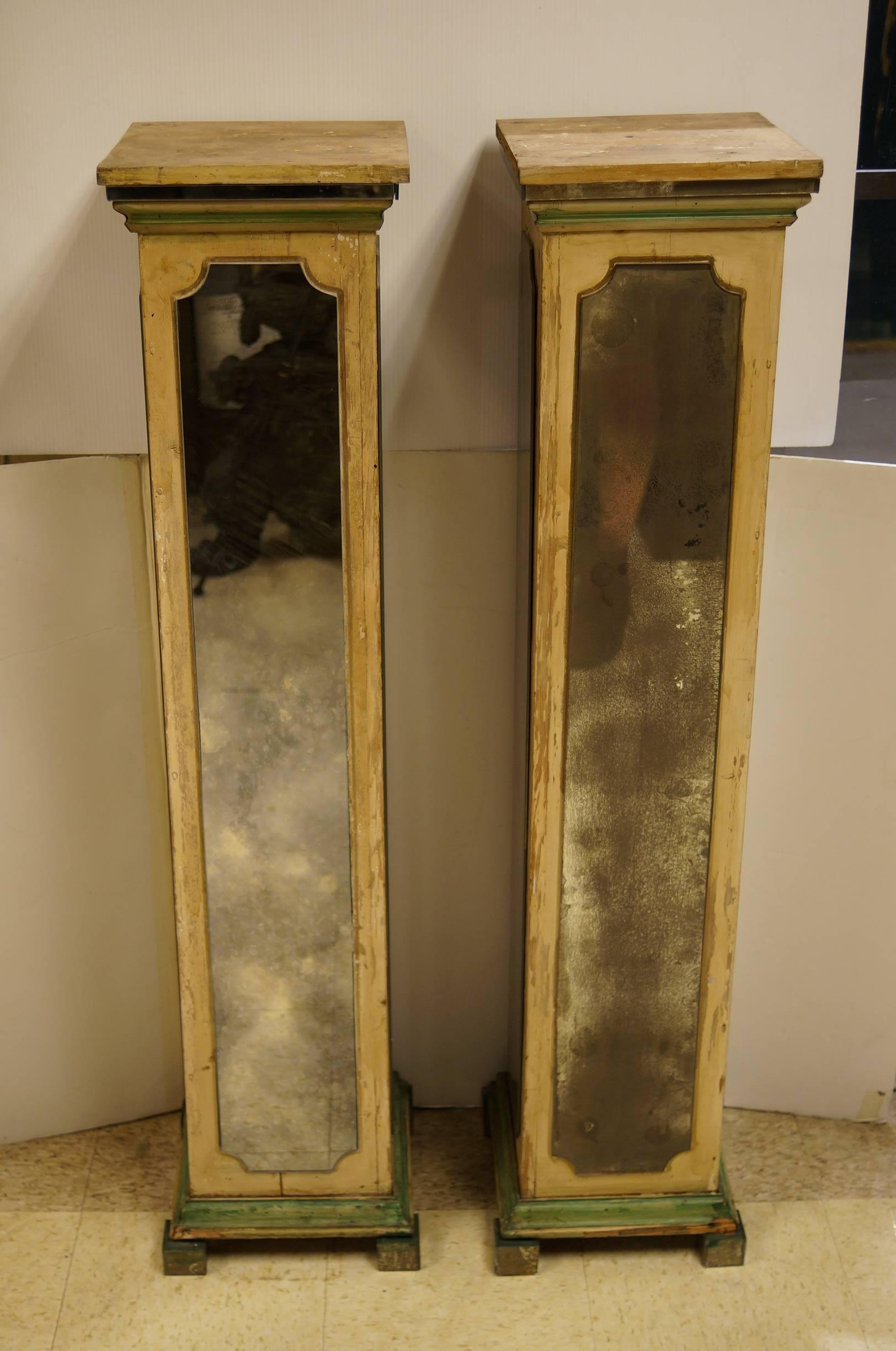 Exquisite pair of mirrored pedestal stands in square form attributed to Maison Jansen.
All four sides with faded design mirrors.

From its beginnings Maison Jansen combined traditional furnishings with influences of new trends including