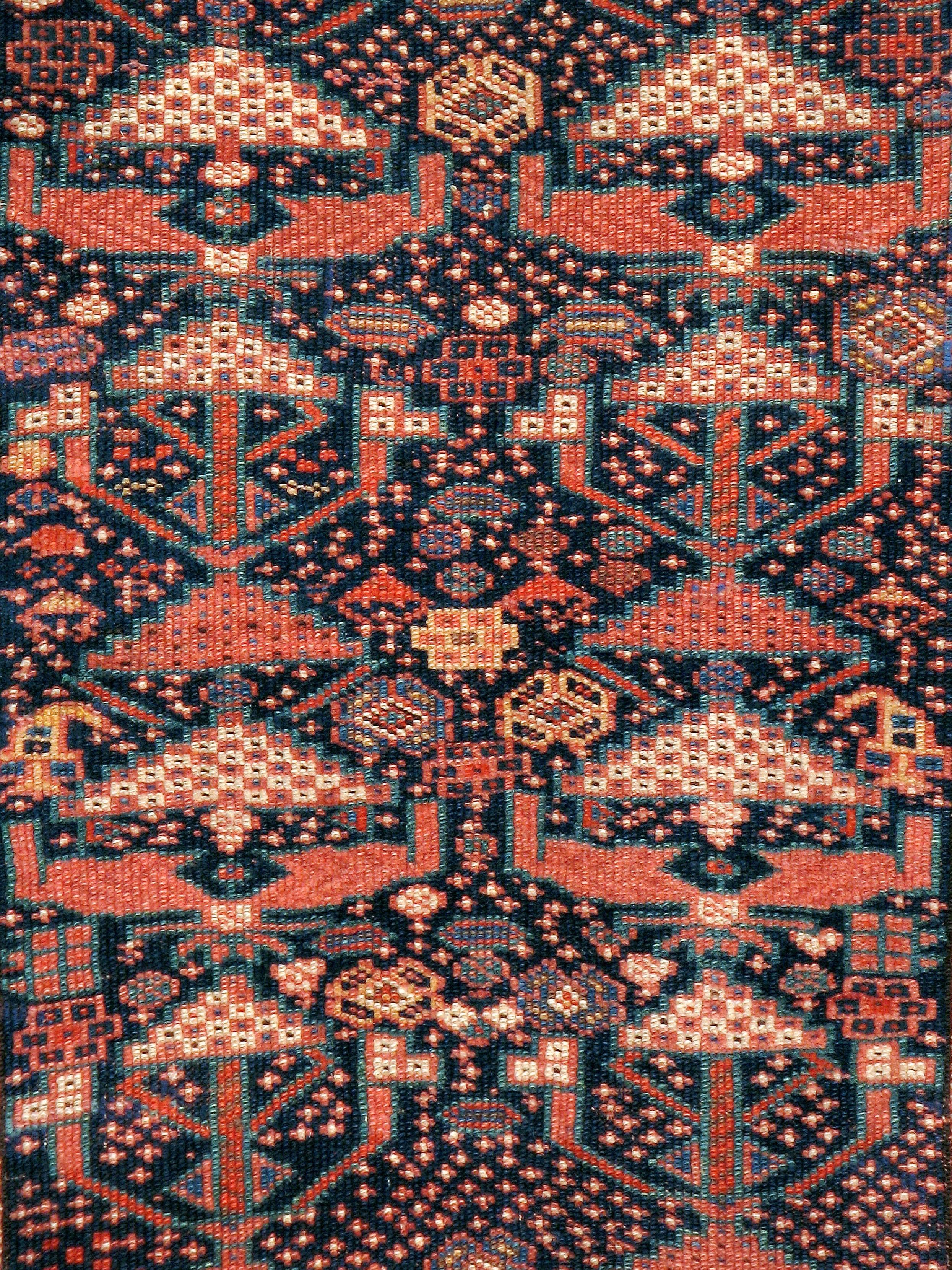 An antique Persian Shiraz carpet from the first quarter of the 20th century.