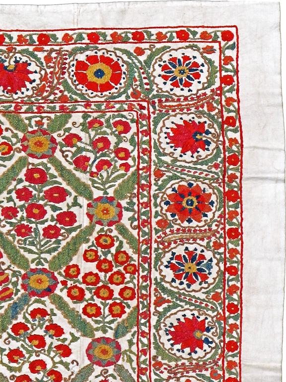 A vintage Uzbek Suzani (needlepoint) textile from the mid-20th century.