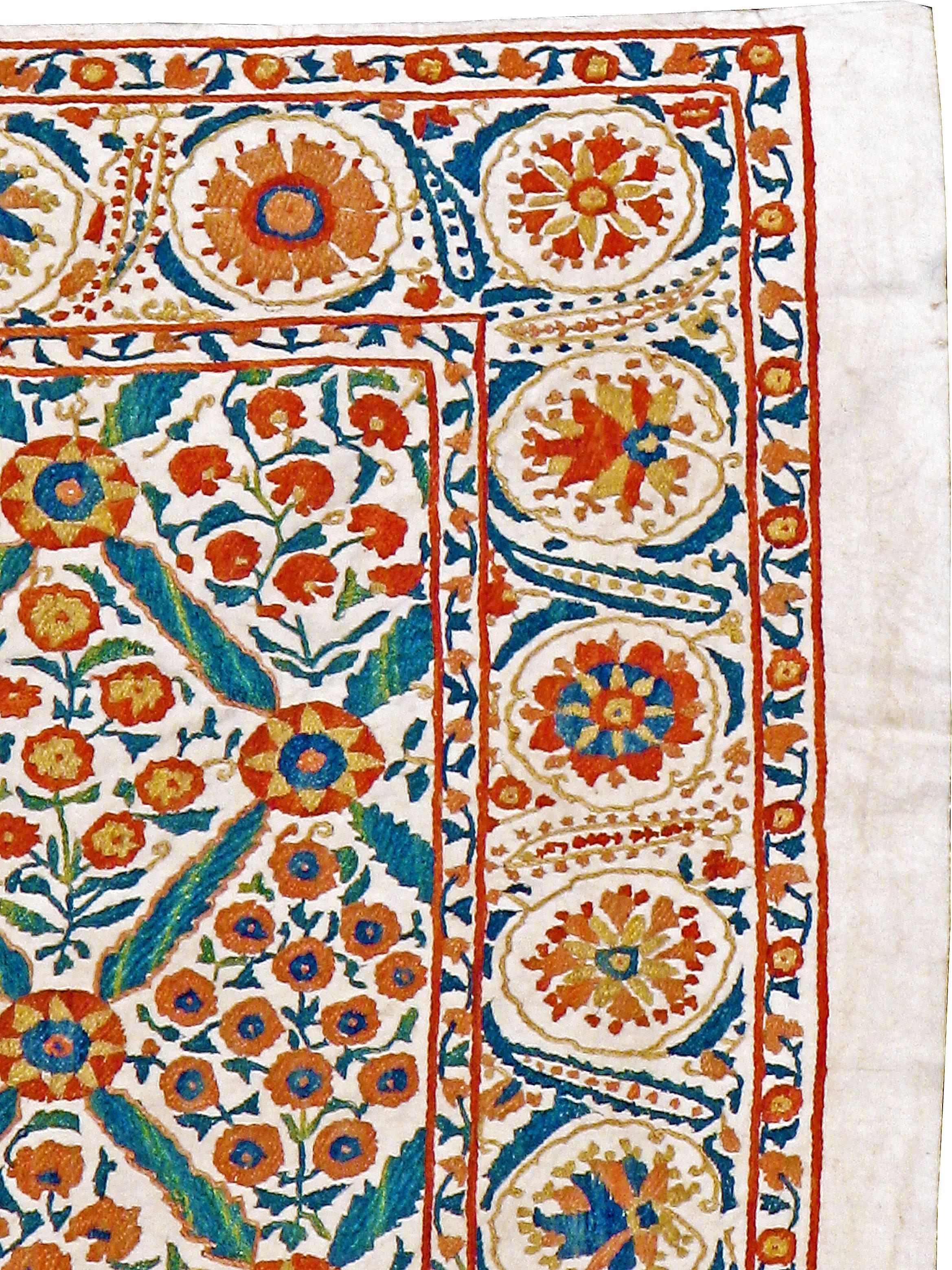 A vintage Uzbek Suzani (needlepoint) textile from the mid-20th century.