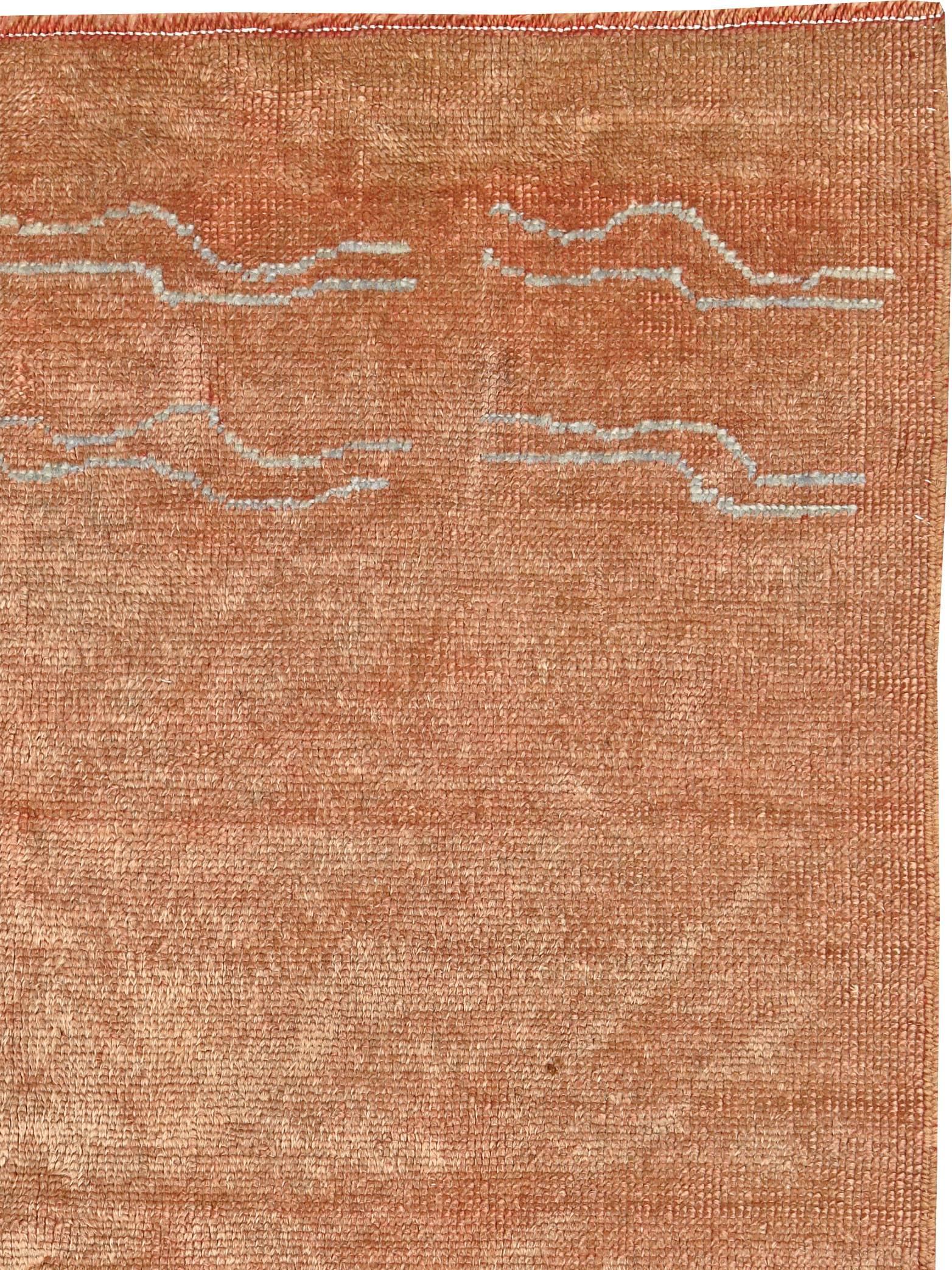An antique Turkish Oushak carpet from the first quarter of the 20th century.