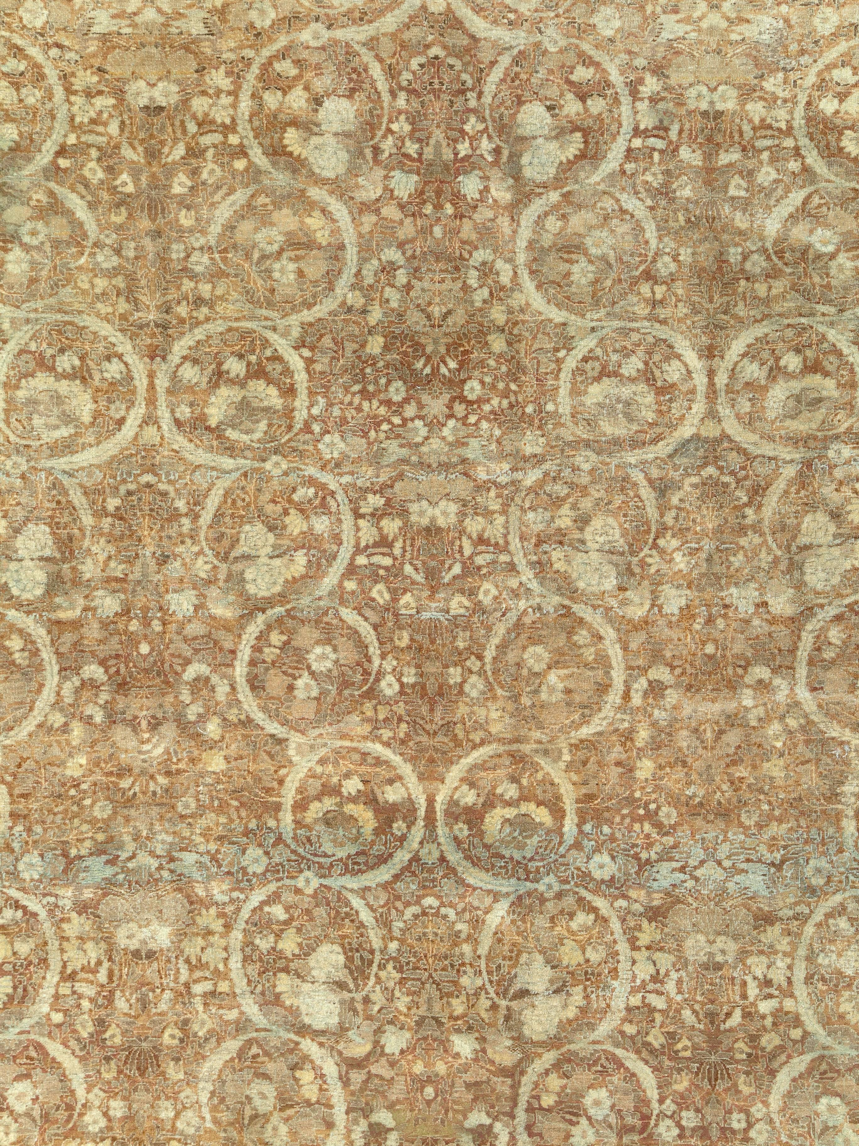 An antique Persian Lavar Kerman carpet from the first quarter of the 20th century.
