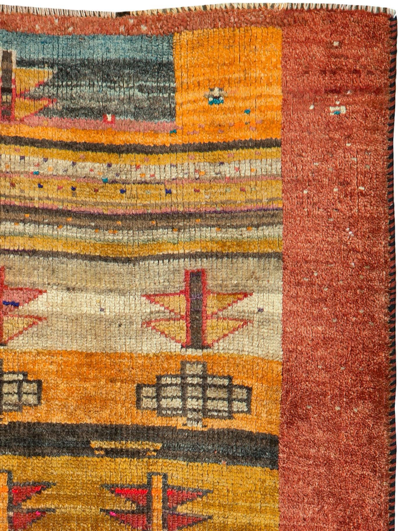 An antique Persian Gabbeh carpet from the second quarter of the 20th century.