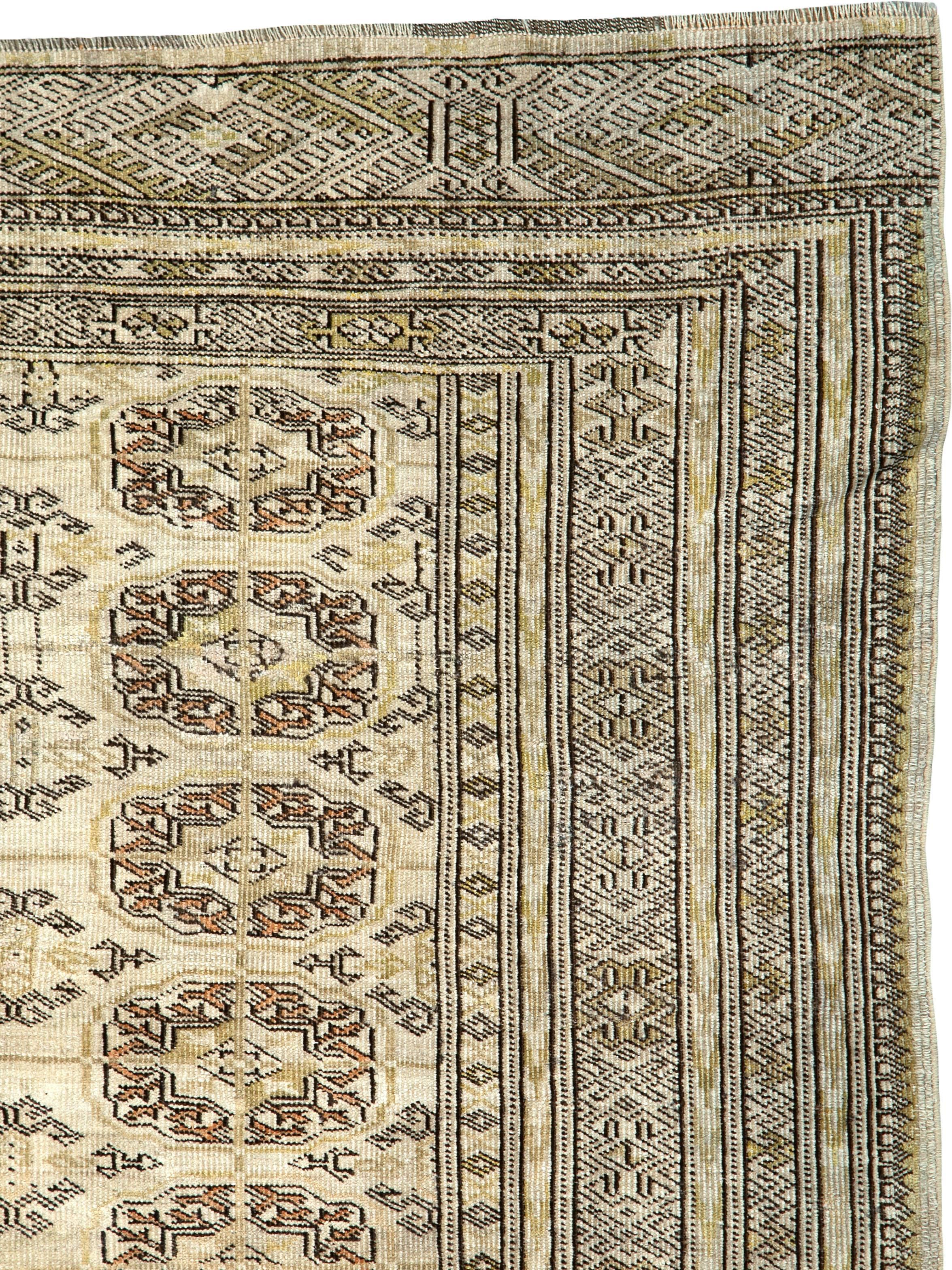 A vintage Central Asian Turkoman carpet from the mid-20th century.