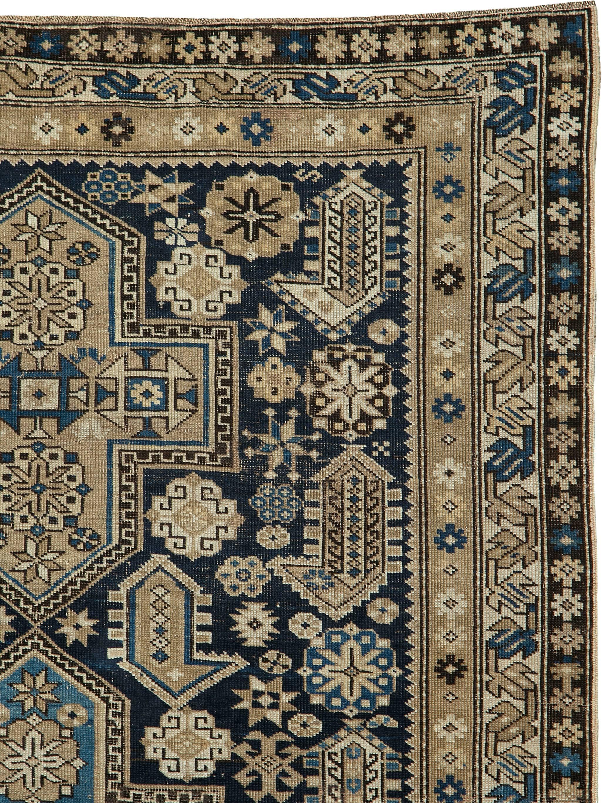 An antique Caucasian Shirvan carpet from the turn of the 20th century.