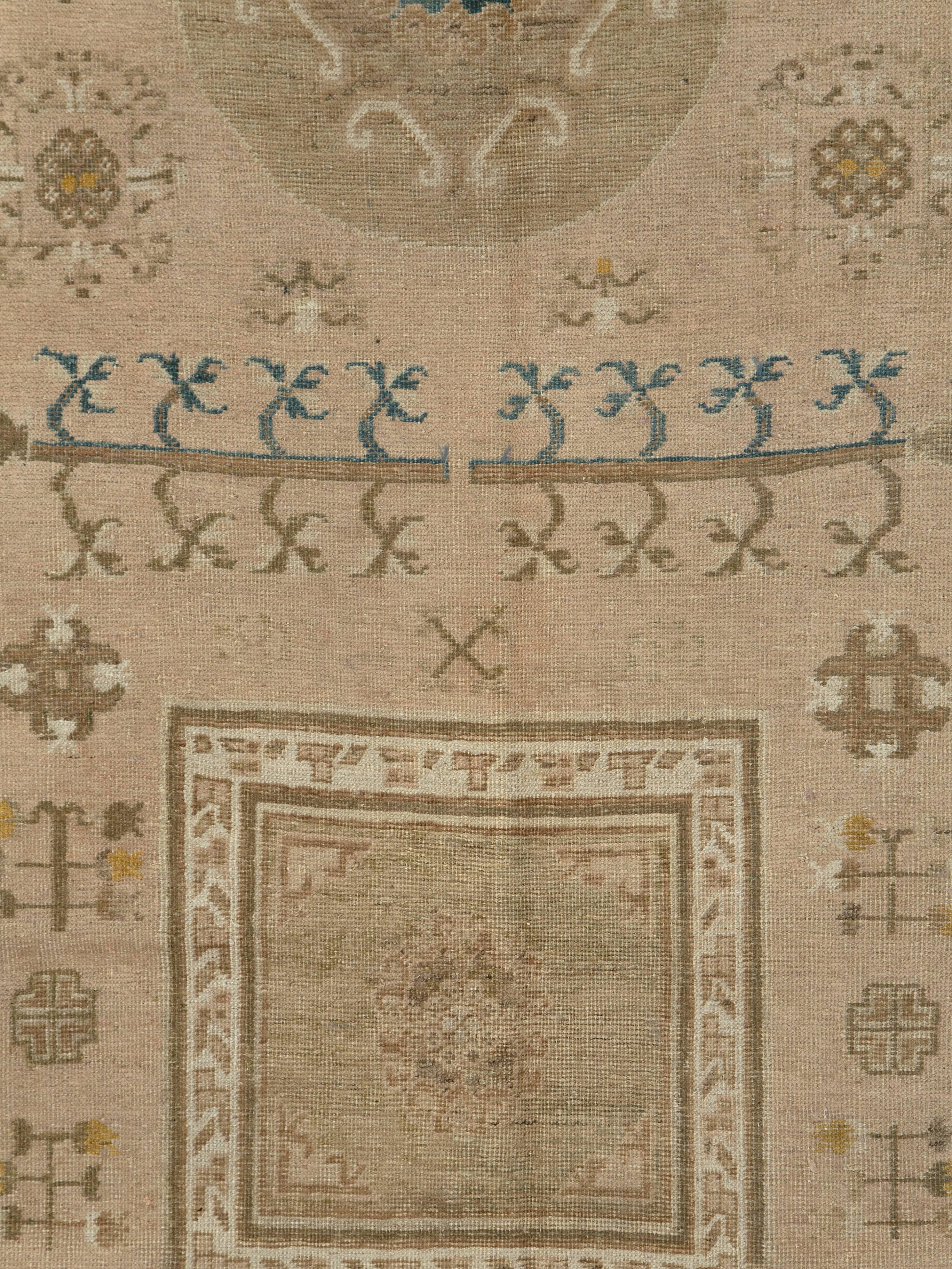 An antique East Turkestan Khotan carpet from the first quarter of the 20th century.