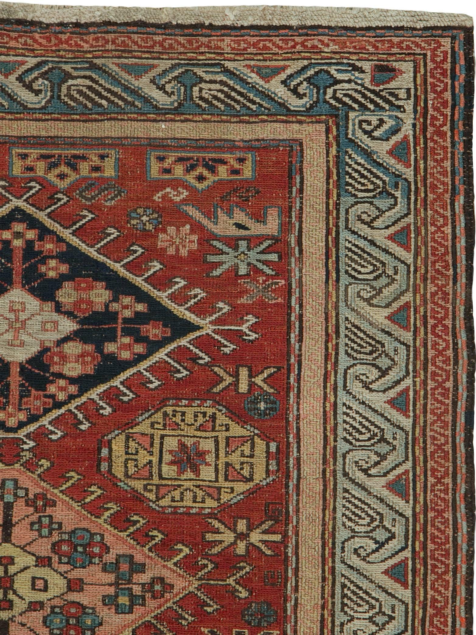 An antique Persian Sumak carpet from the first quarter of the 20th century.