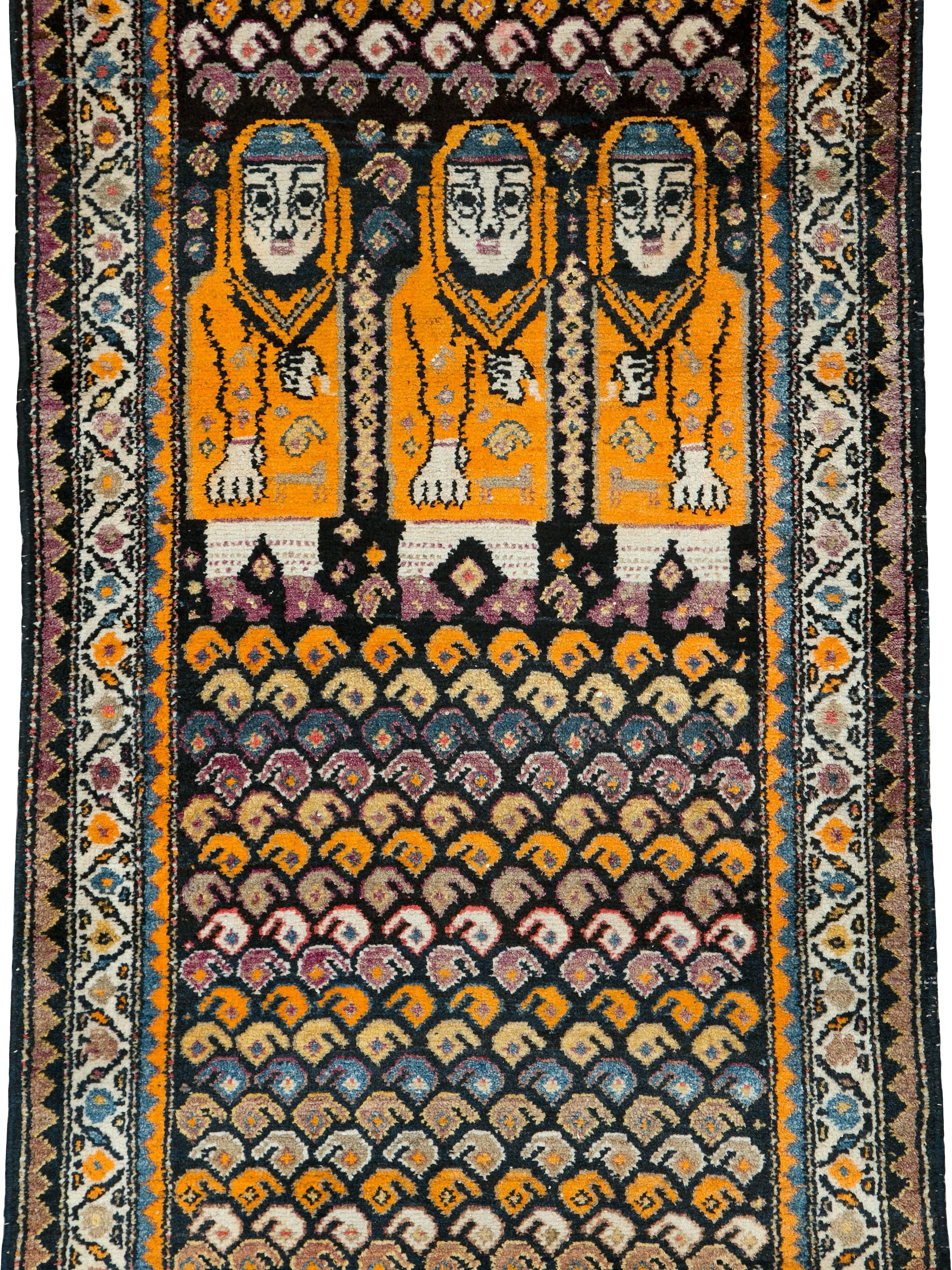 An antique Persian Malayer carpet from the first quarter of the 20th century with a pictorial design.