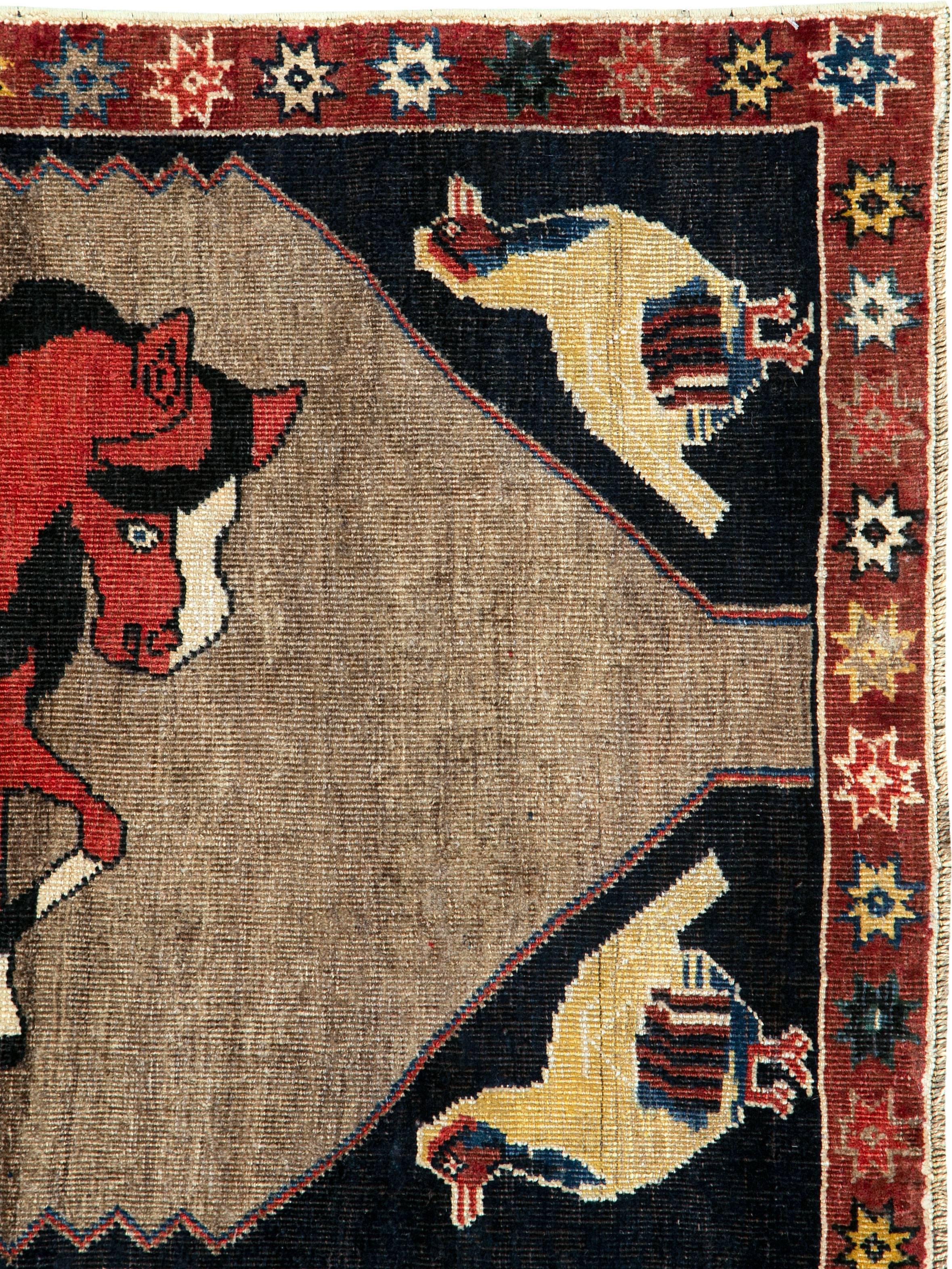 An antique Persian Kurd carpet from the second quarter of the 20th century with a pictorial design.
