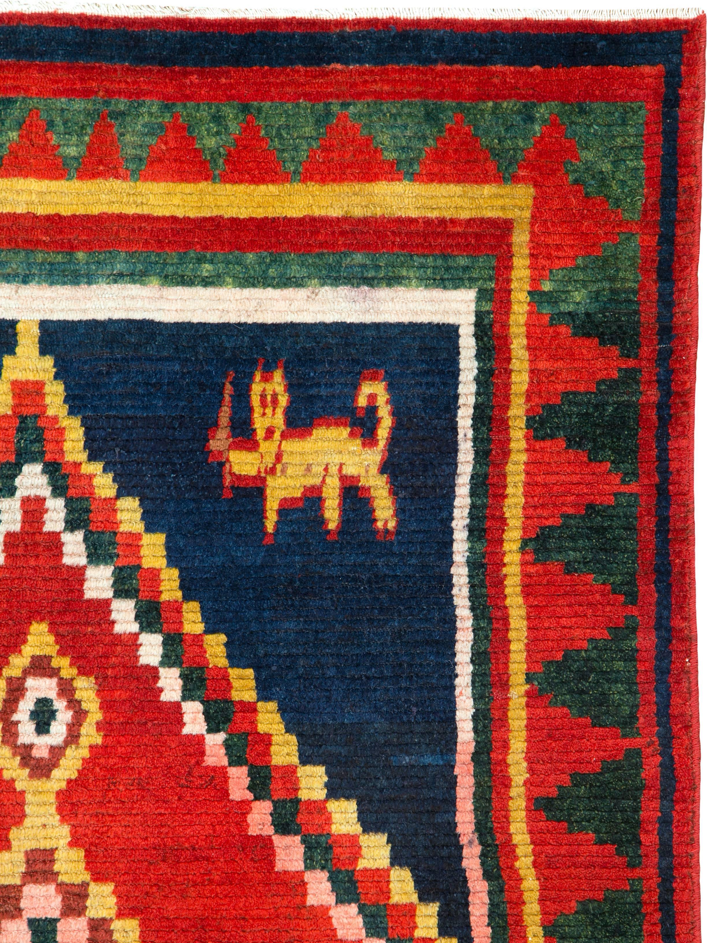 An antique Persian Gabbeh carpet from the second quarter of the 20th century.