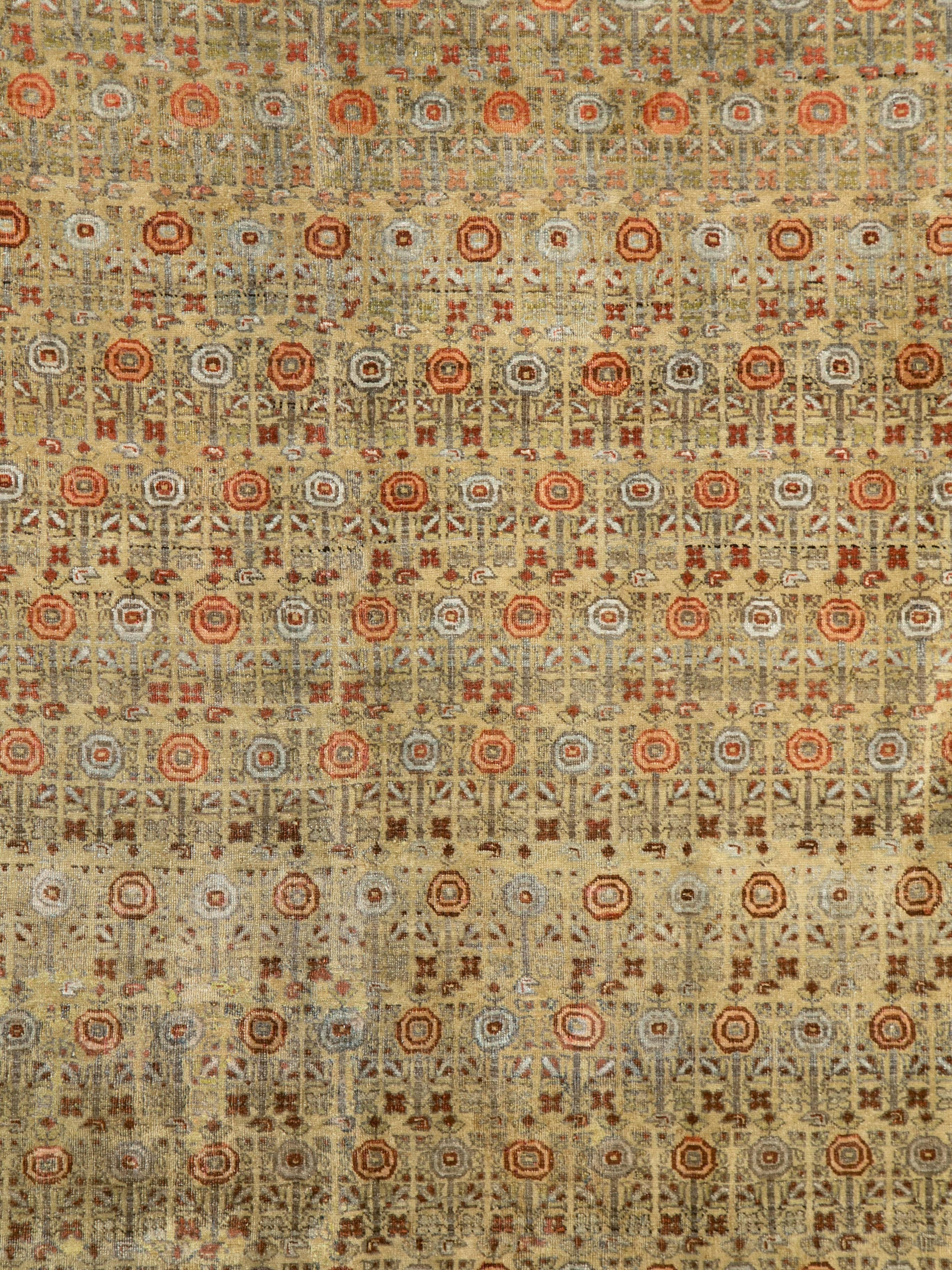 An antique washed Persian Bidjar carpet from the first quarter of the 20th century.