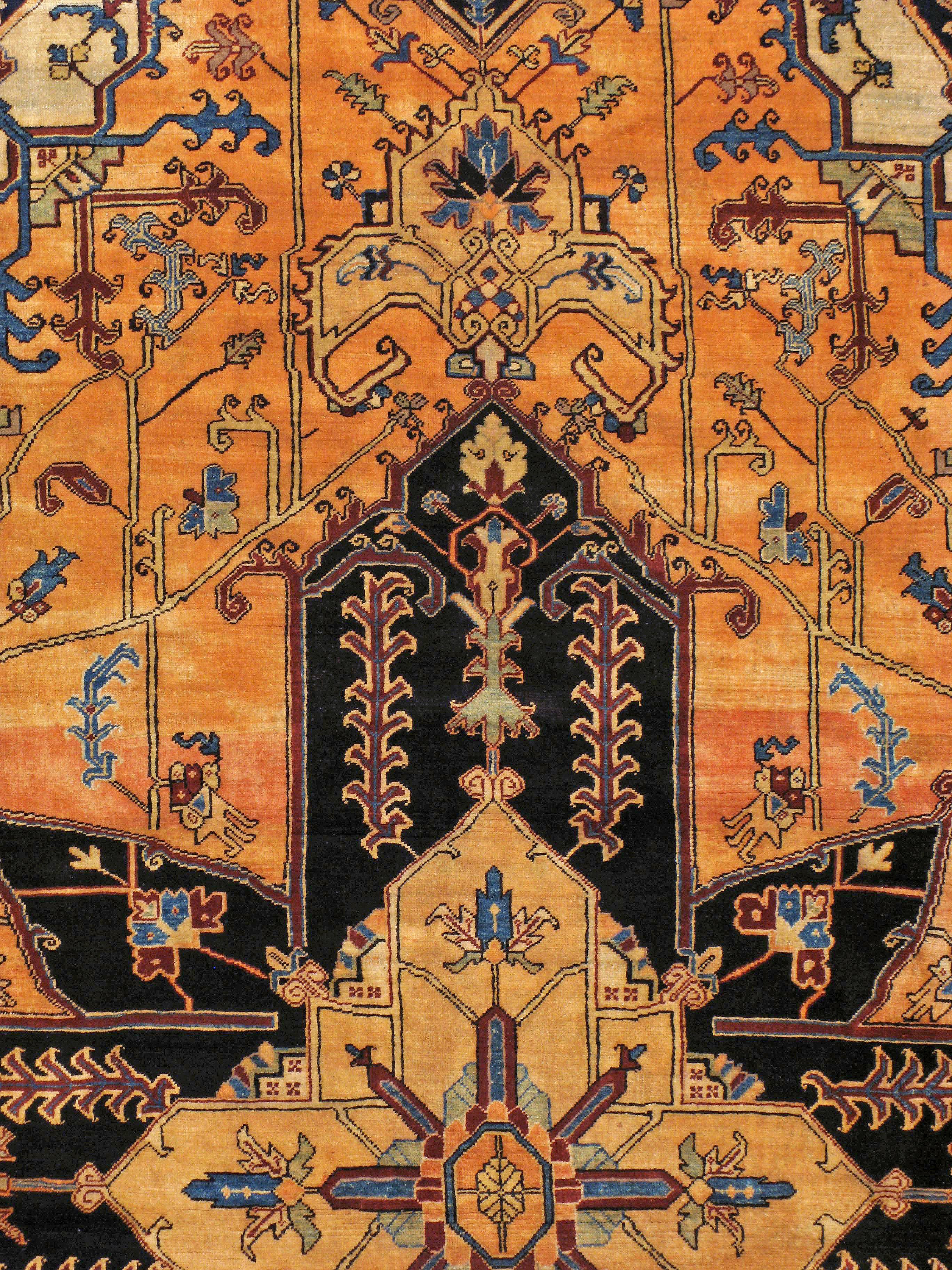 A vintage Persian Heriz carpet from the mid-20th century.