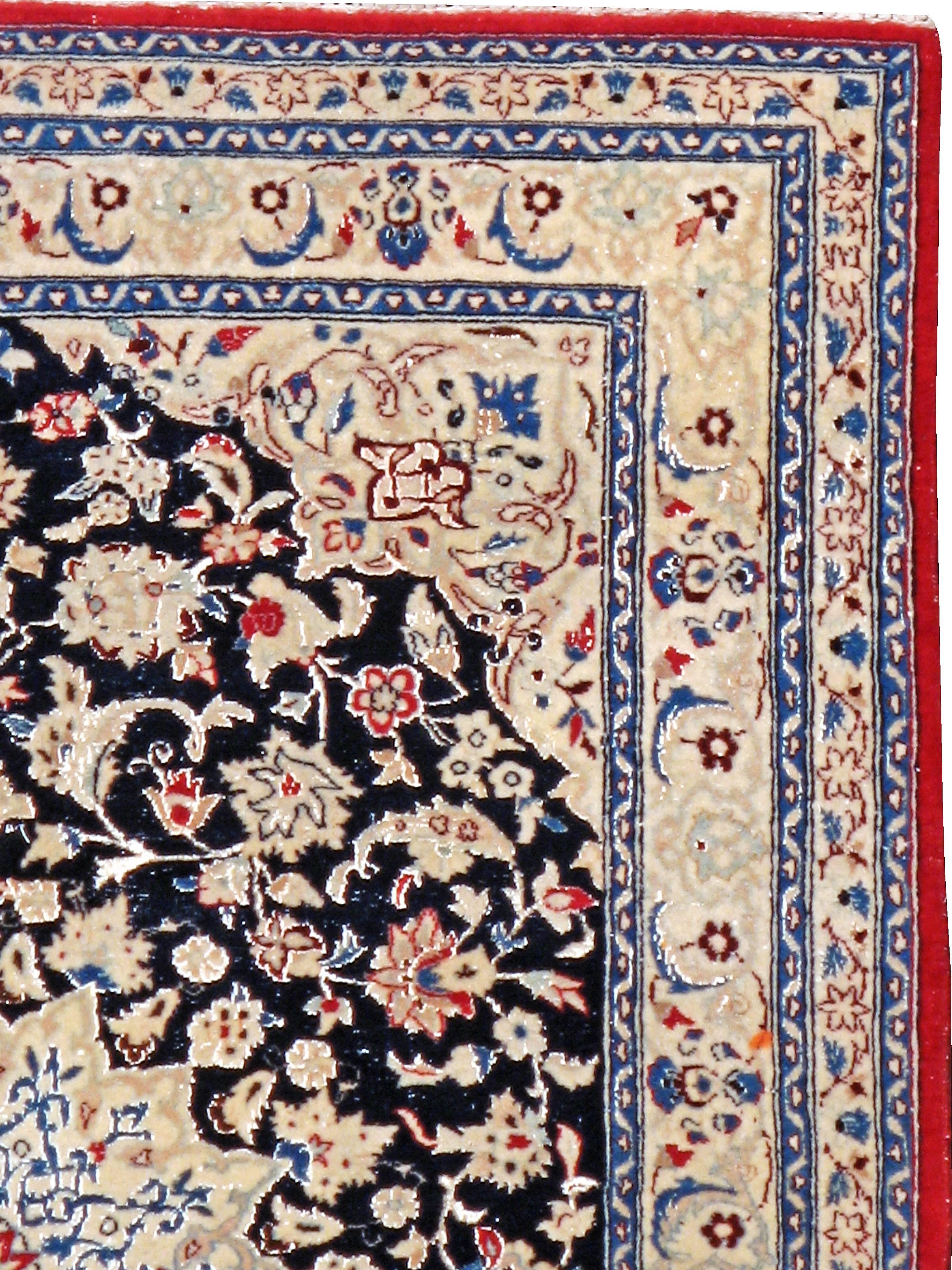A vintage Persian Nain carpet from the mid-20th century with silk highlights.
