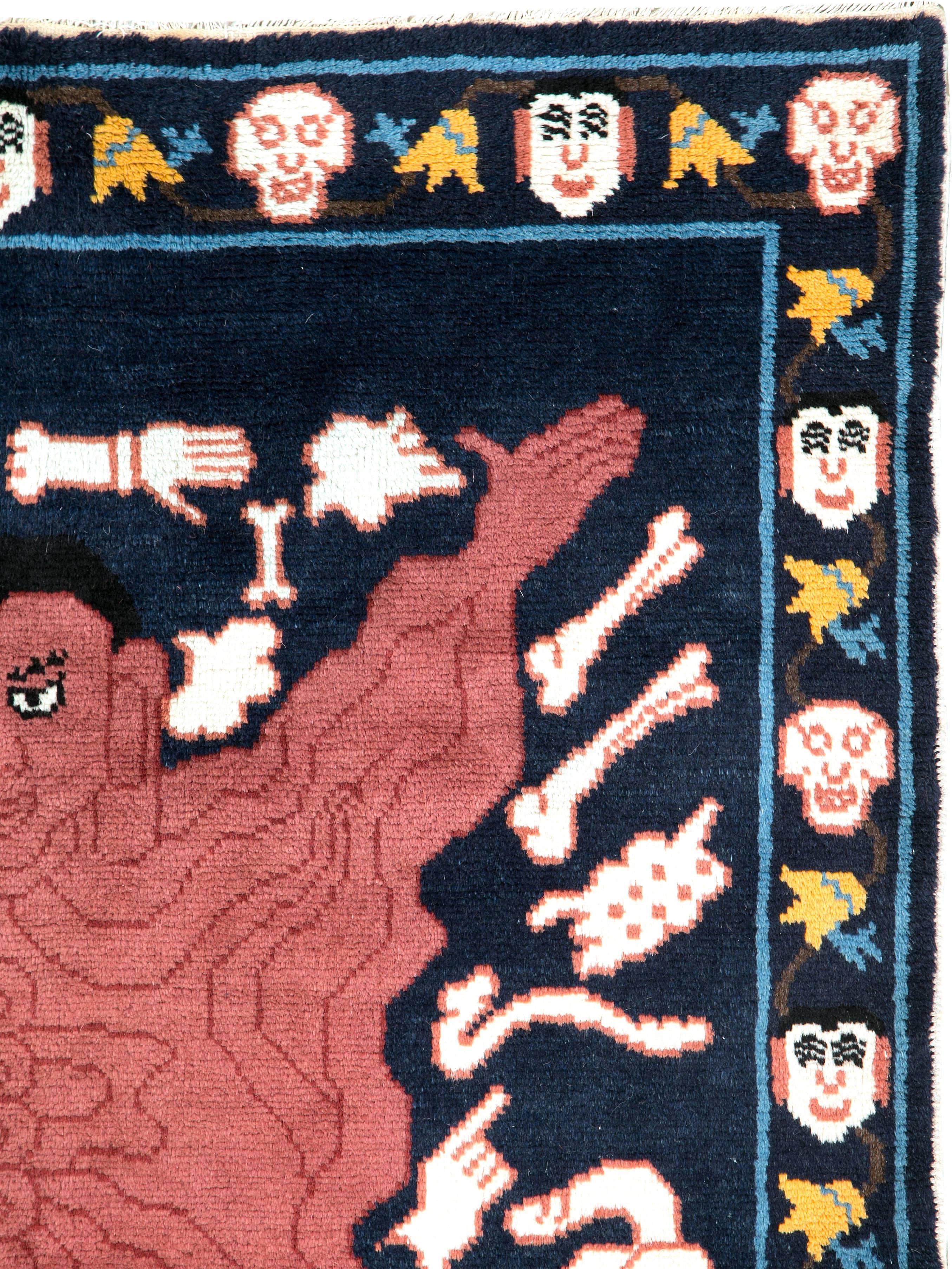 A vintage Tibetan Tantric carpet from the mid-20th century with a pictorial design of a flayed man. The macabre motif sits atop a deep blue field.

Employed by Vajrayana Buddhists as seats of power during the practice of esoteric rites associated
