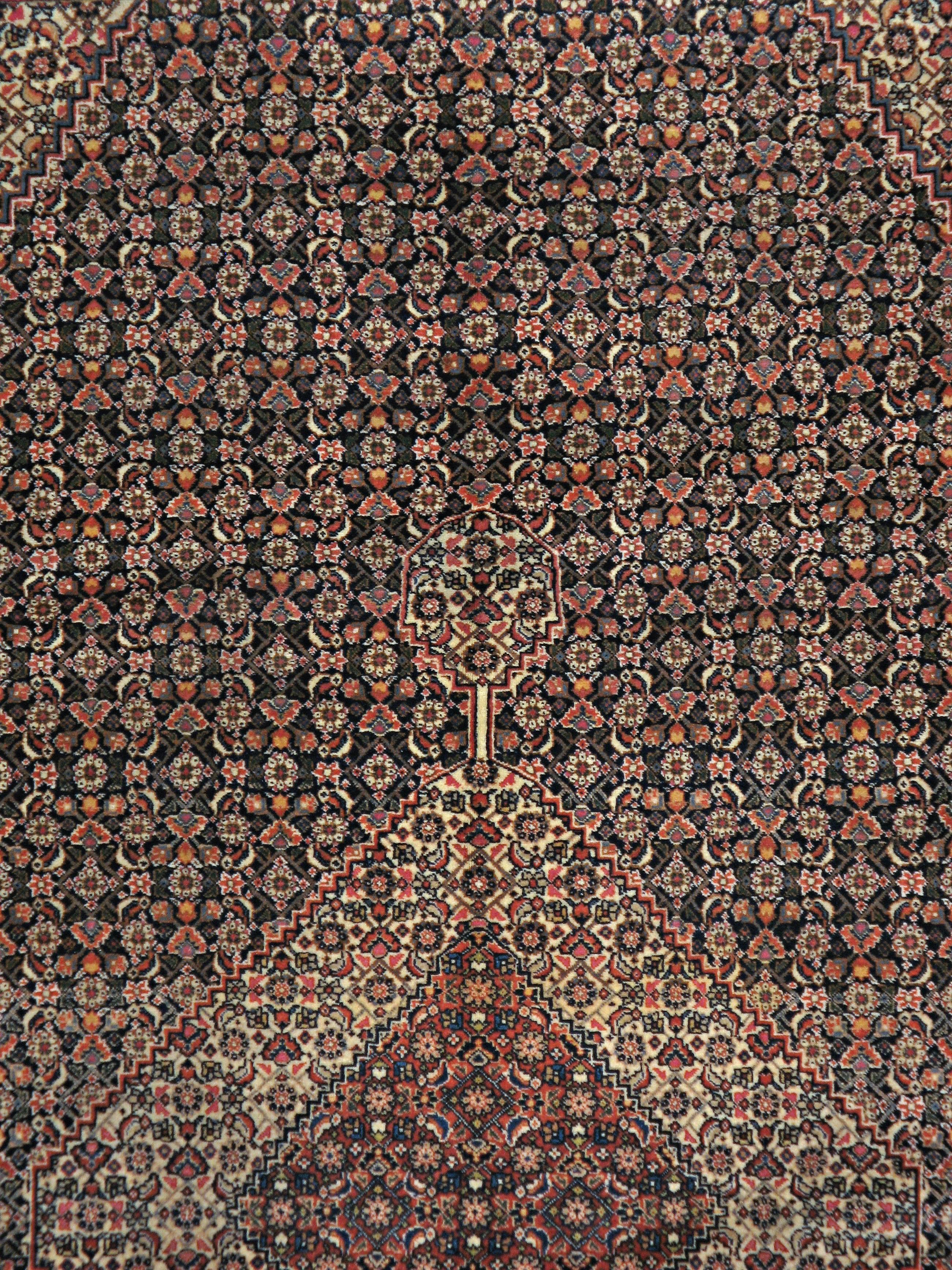 An antique Persian Tabriz carpet from the second quarter of the 20th century.