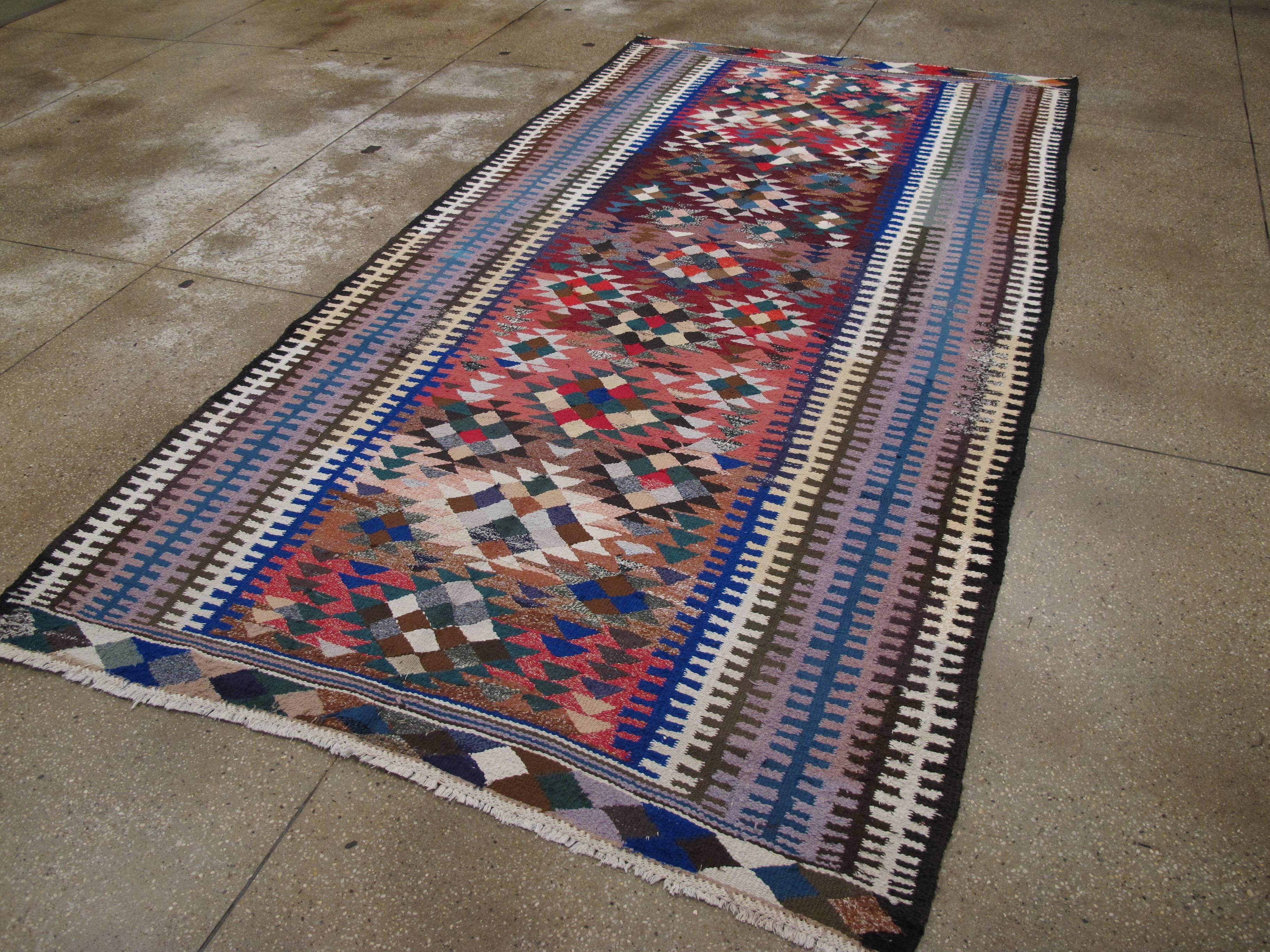 A colorful vintage Persian flat-woven Kilim carpet from the mid-20th century (reversible).