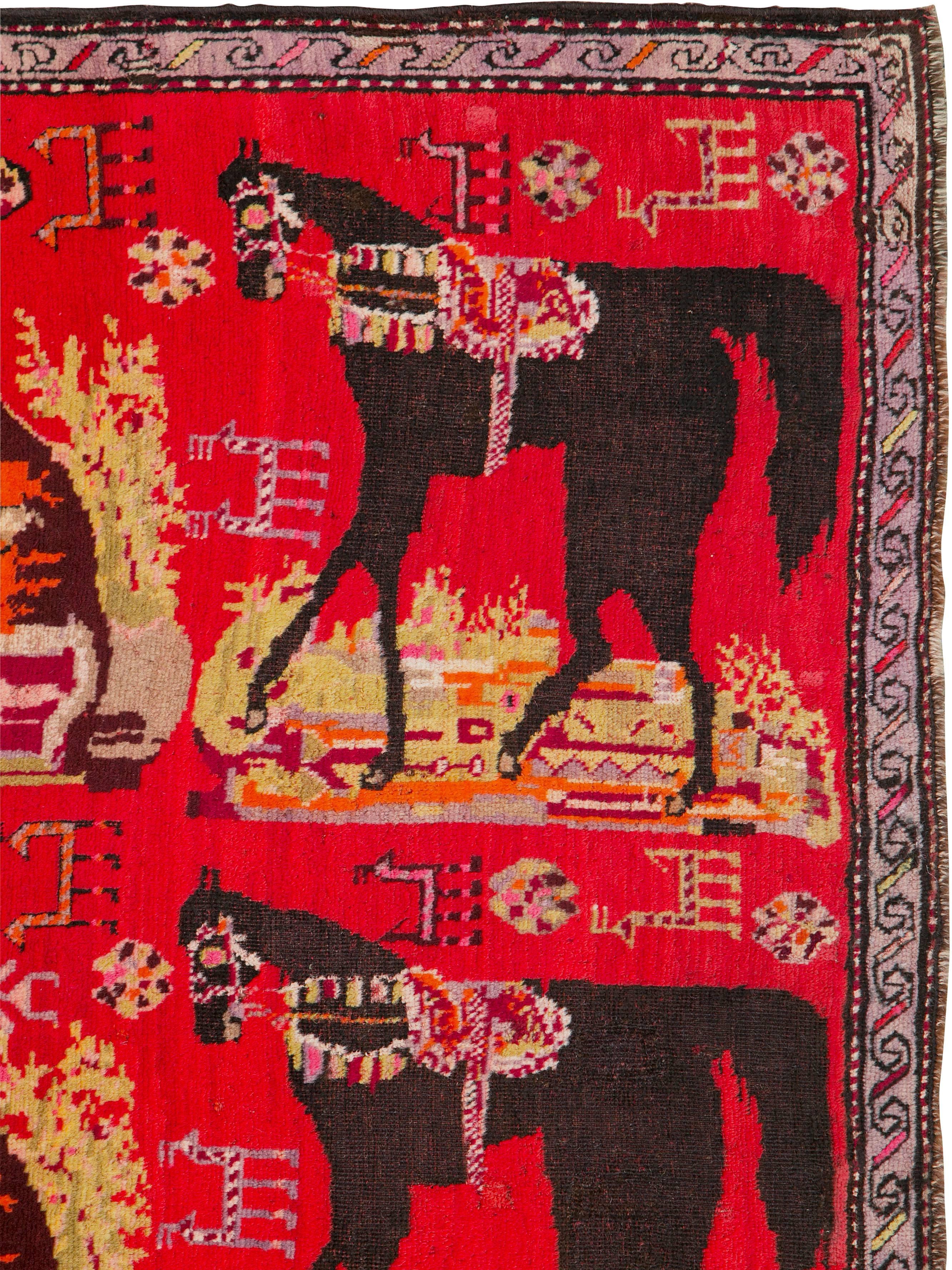 An early 20th century pictorial Karabagh rug.