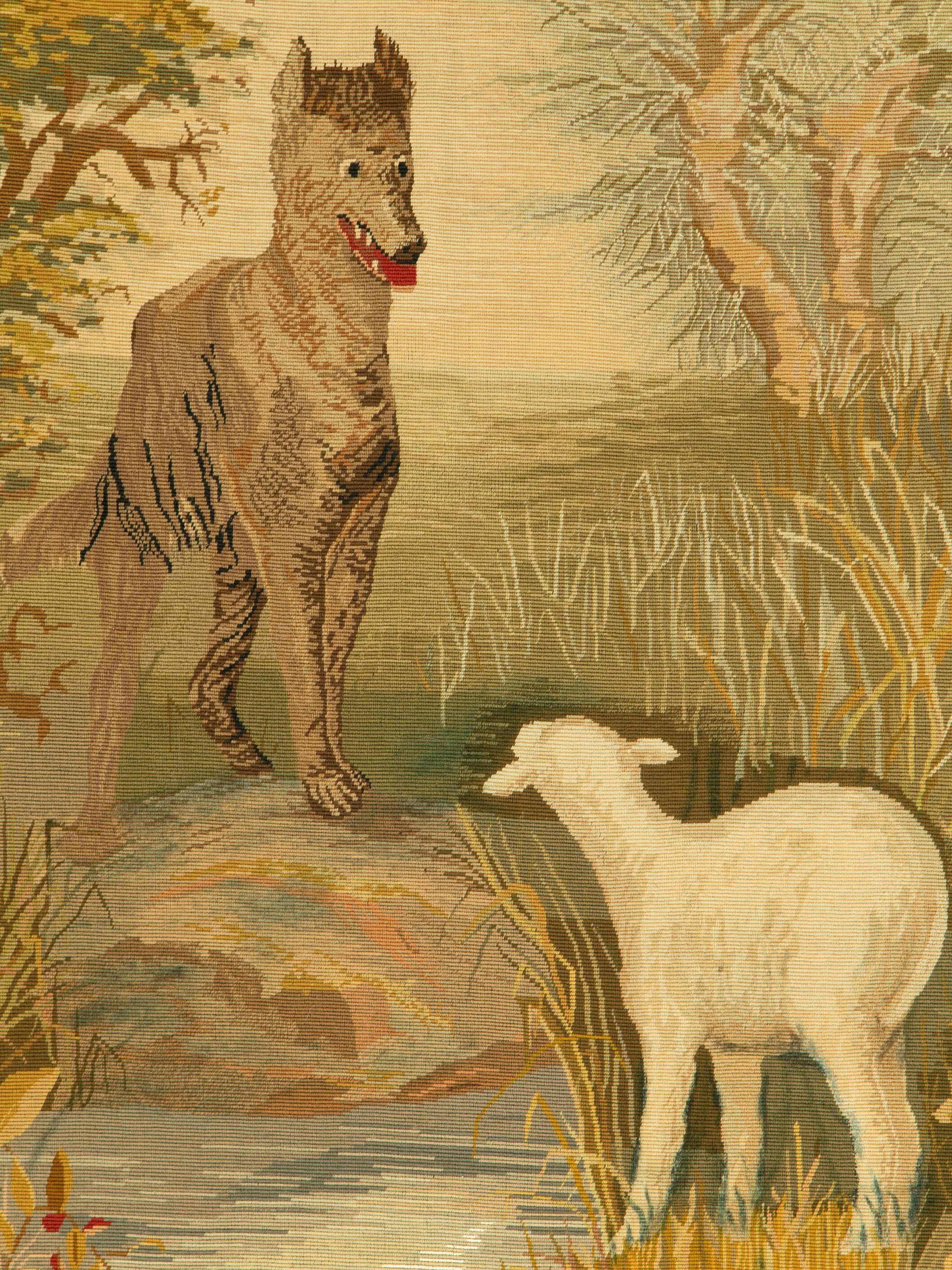 A vintage Fresh tapestry from the mid-20th century. A lamb is greedily eyed by a hungry wolf and we know what will happen next. This panel depicts an Aesopian fable, “The Wolf and the Lamb.” The animals and setting are realistically depicted in