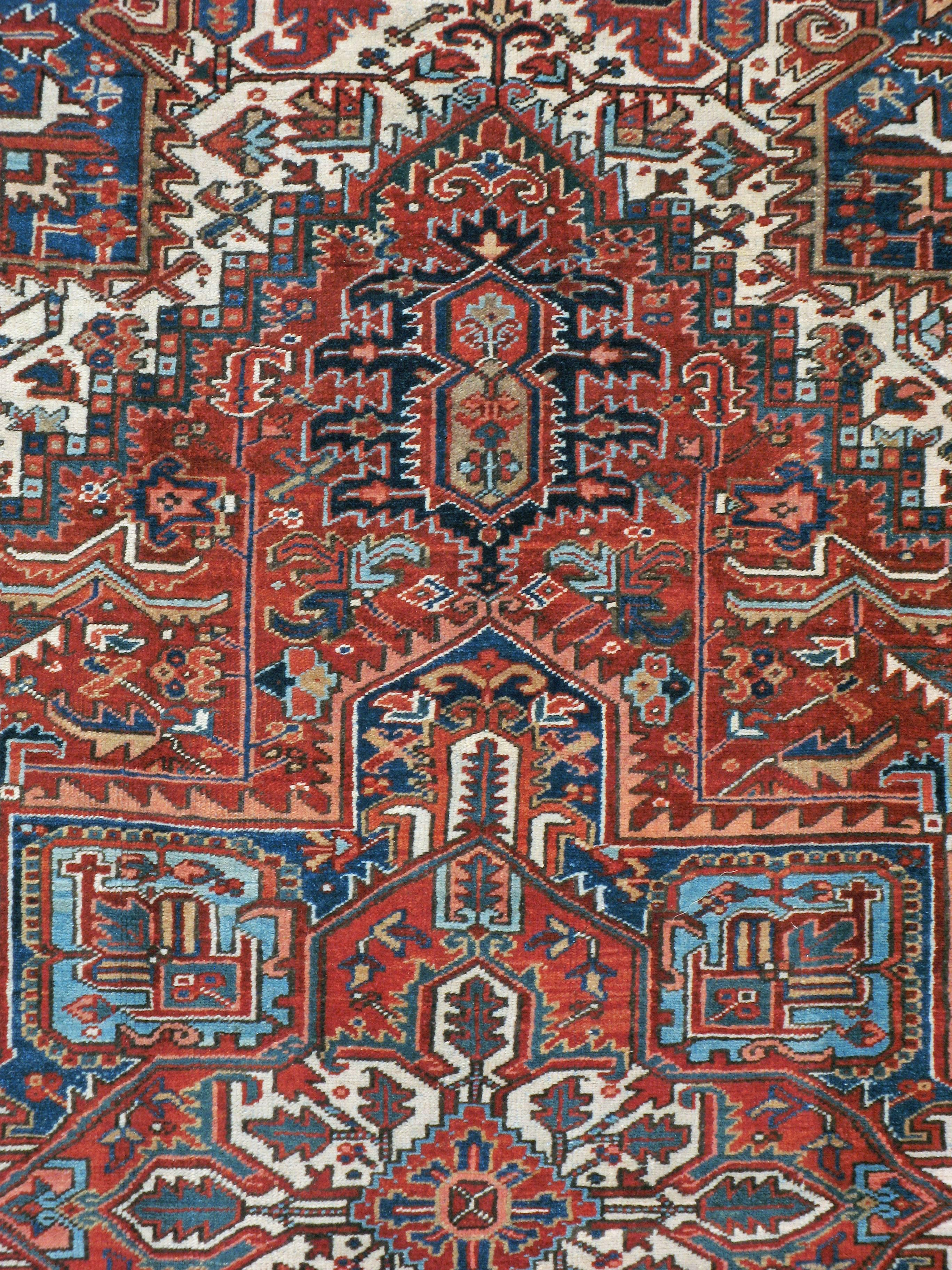 A vintage Persian Heriz rug from the mid-20th century.