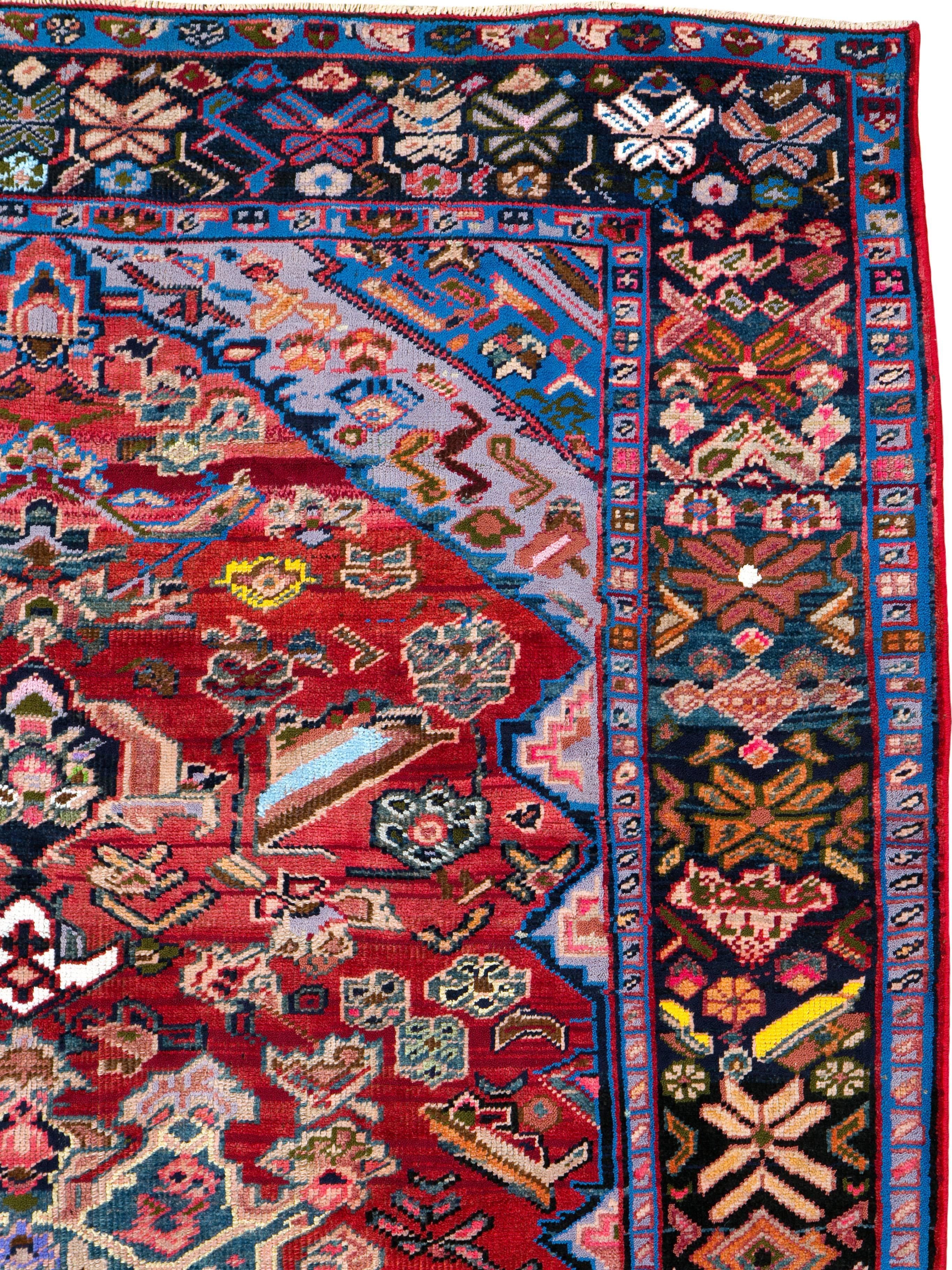 A vintage Persian Bakhtiari rug from the mid-20th century with cotton highlights.
