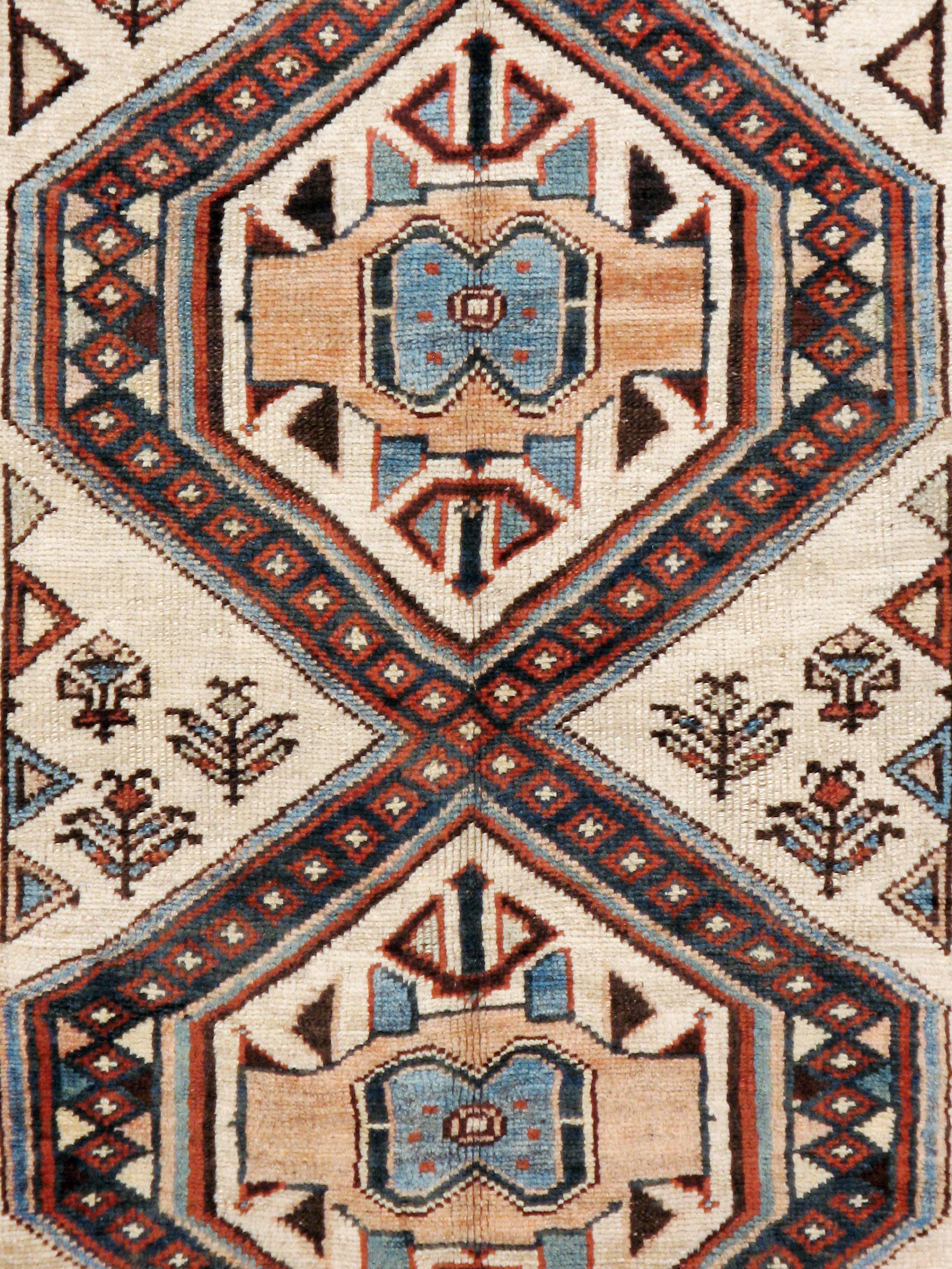 An antique Persian Serab rug in gallery format from the second quarter of the 20th century.