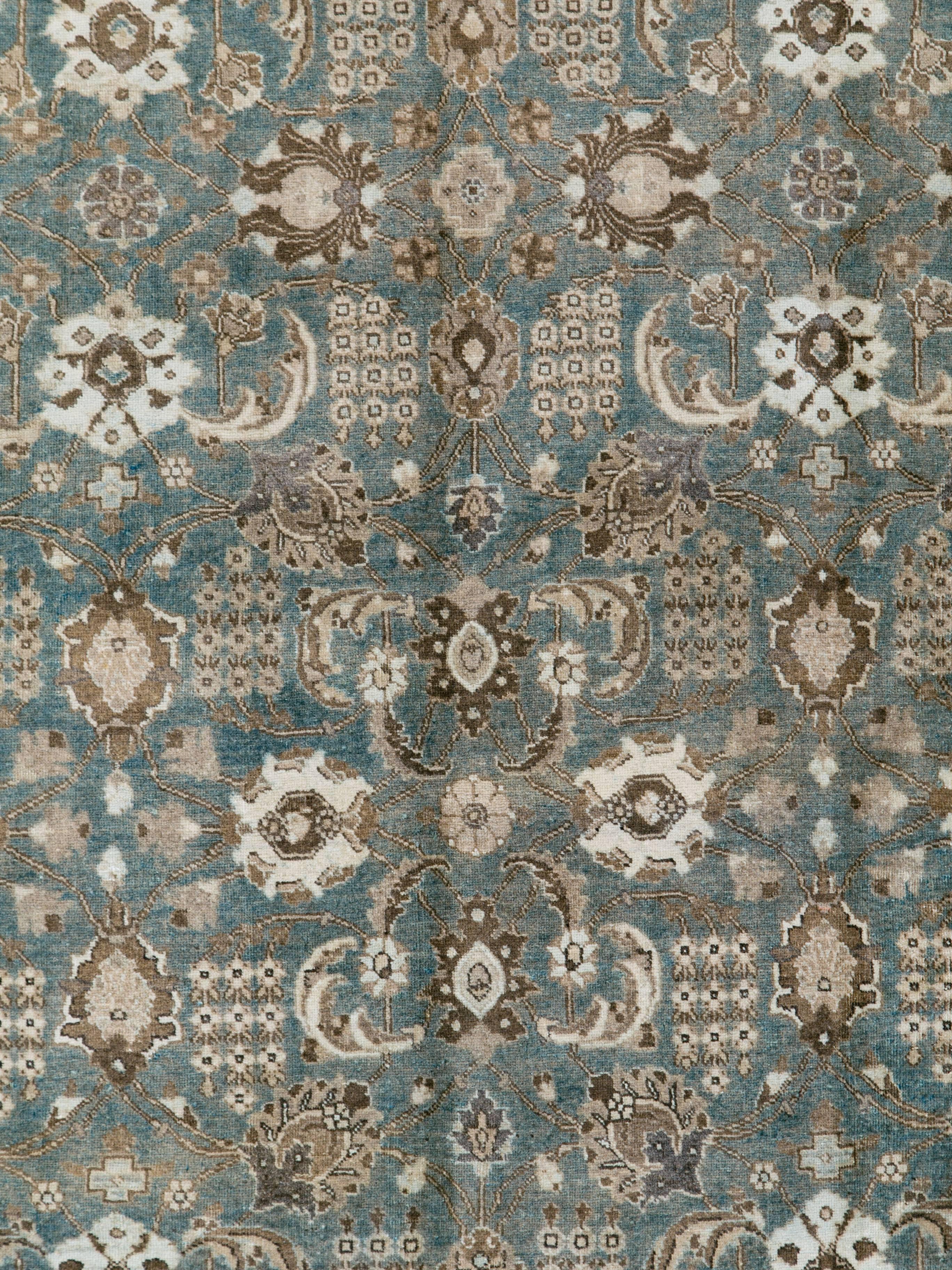 An antique Persian Tabriz rug from the second quarter of the 20th century.