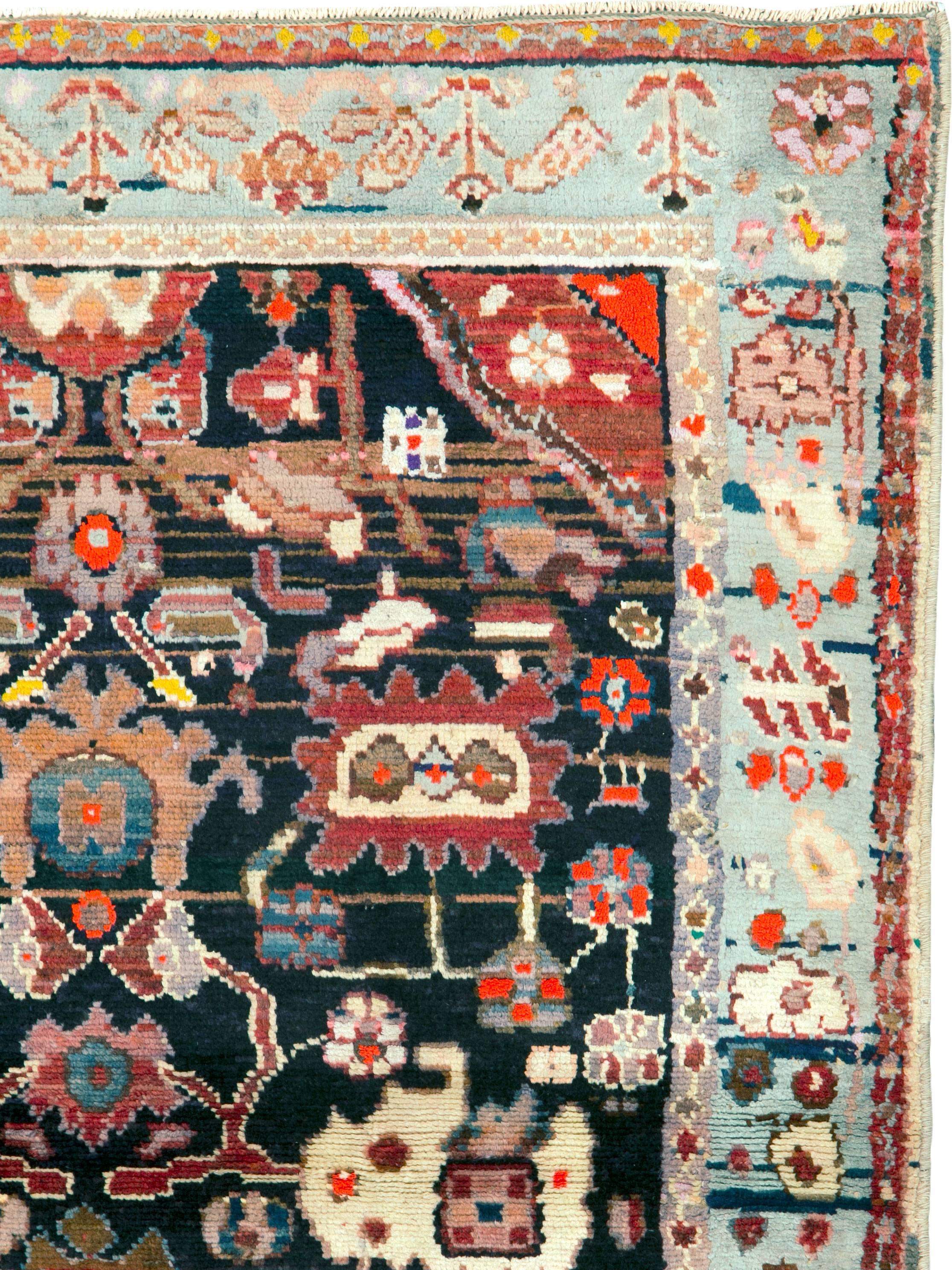 A vintage Persian Malayer rug from the mid-20th century.