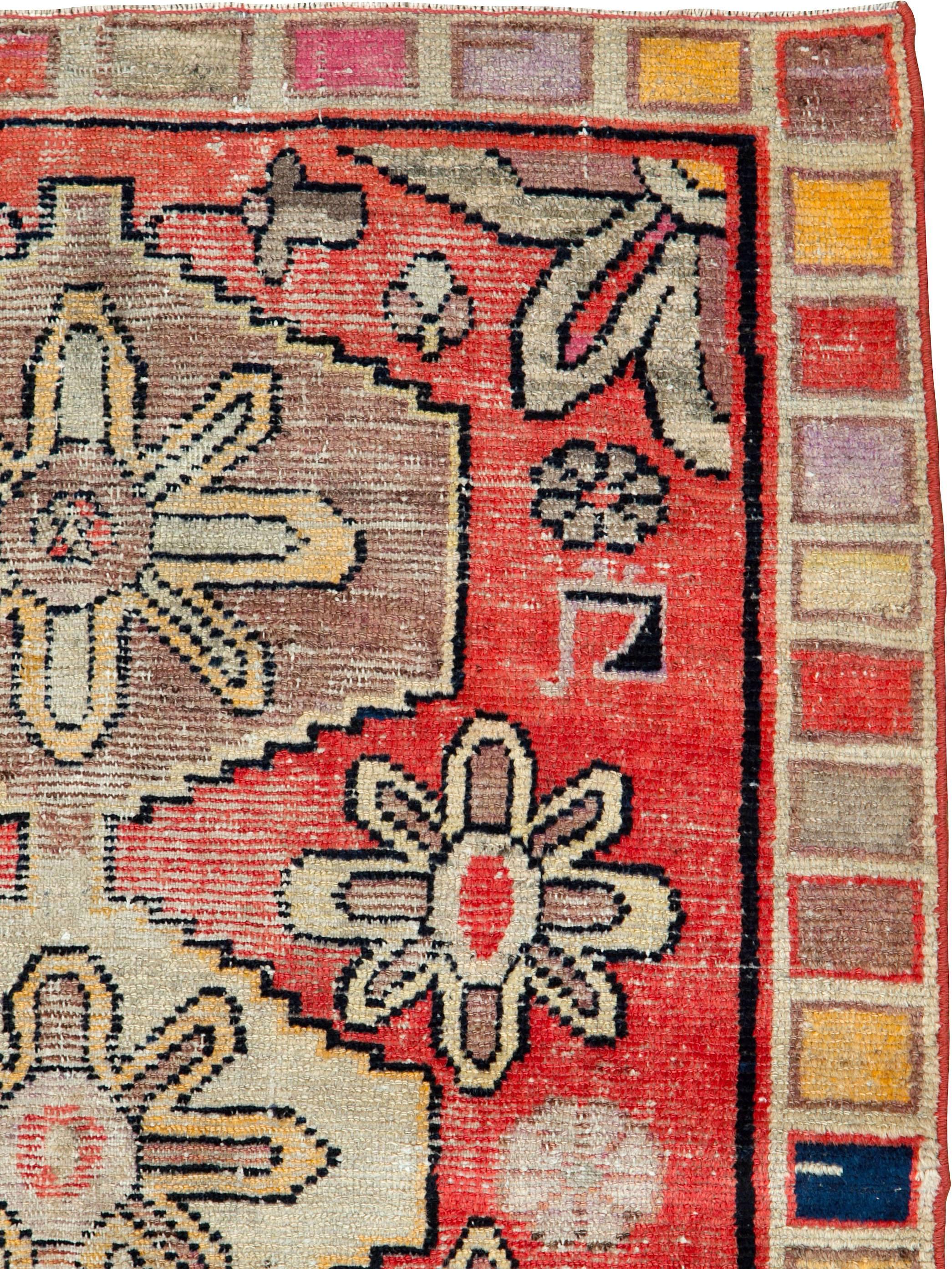 A vintage East Turkestan Khotan rug from the mid-20th century.