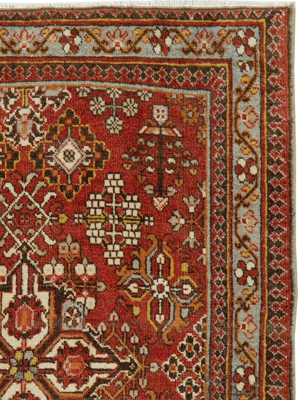 An antique Persian Joshegan rug from the early 20th century.

Measures: 2' 0