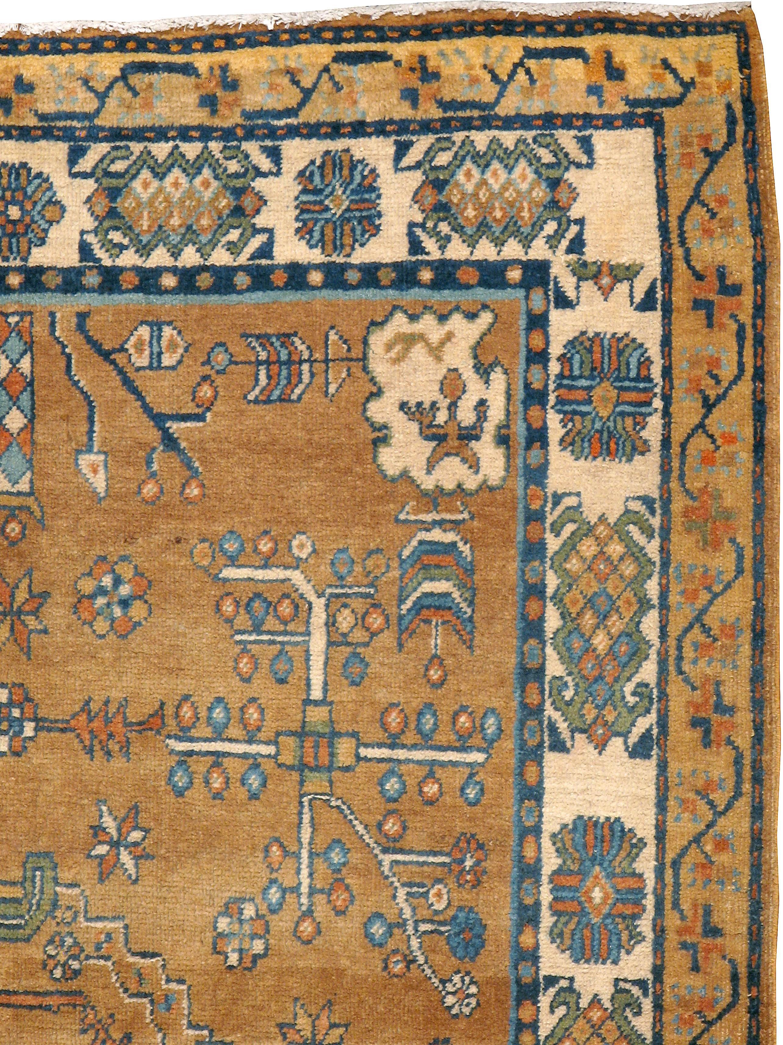 An antique East Turkestan Khotan carpet from the second quarter of the 20th century. Antique Khotan rugs and carpets were produced in the oasis town of Eastern Turkestan, today part of the Xinjiang region in Western China. This area has had a steady
