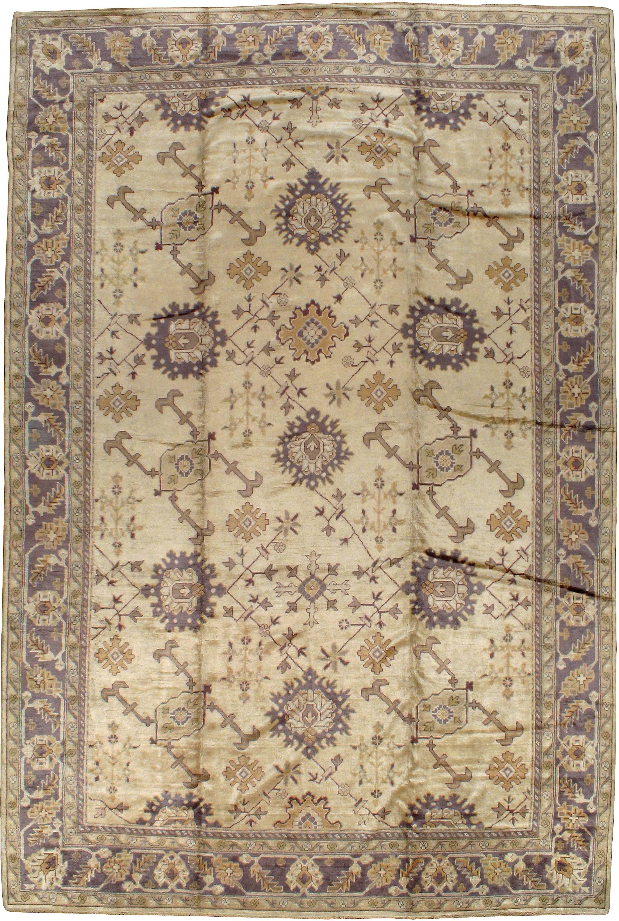An antique Turkish Oushak carpet from the second quarter of the 20th century.