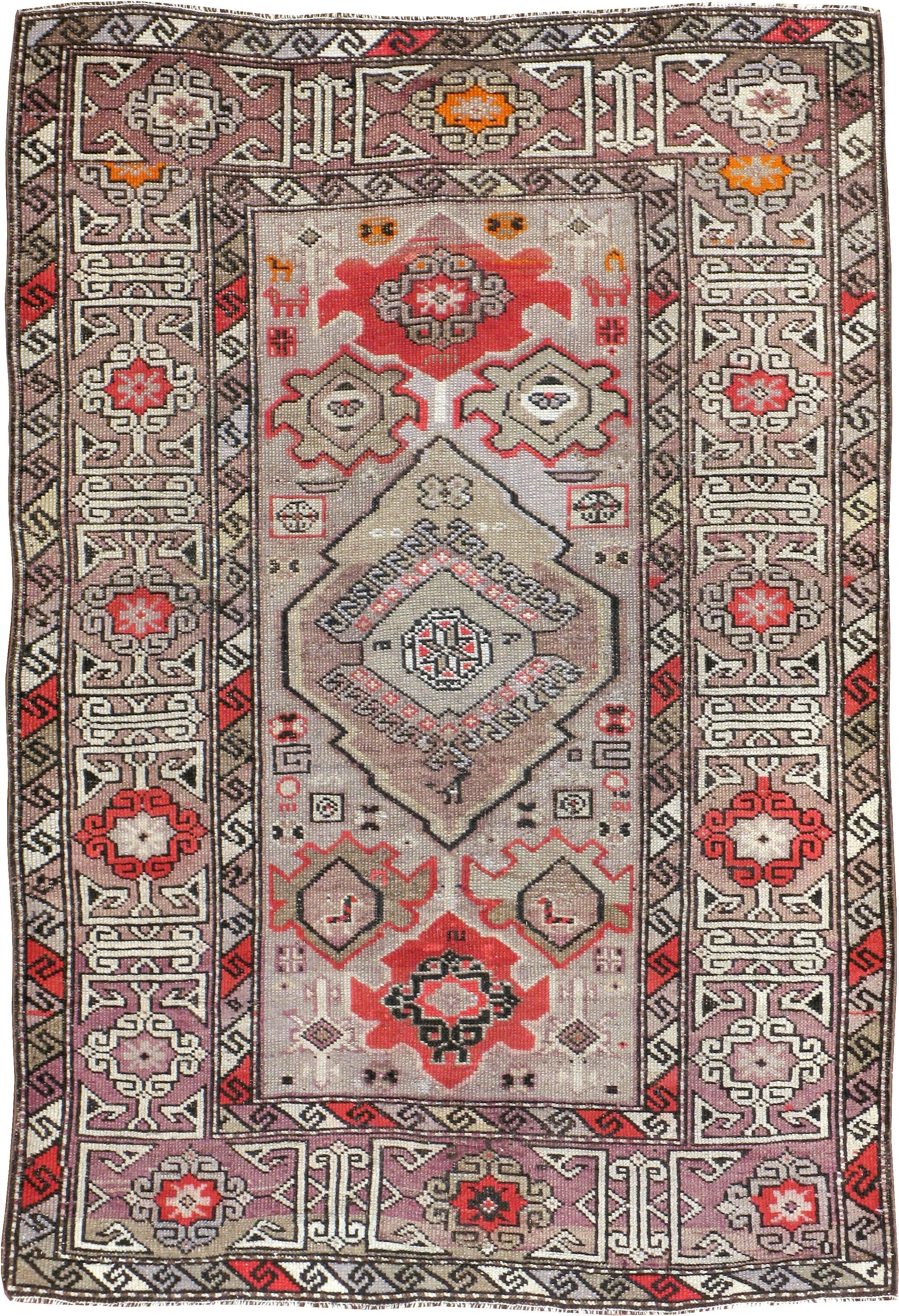 An antique Caucasian carpet from the turn of the 20th century.