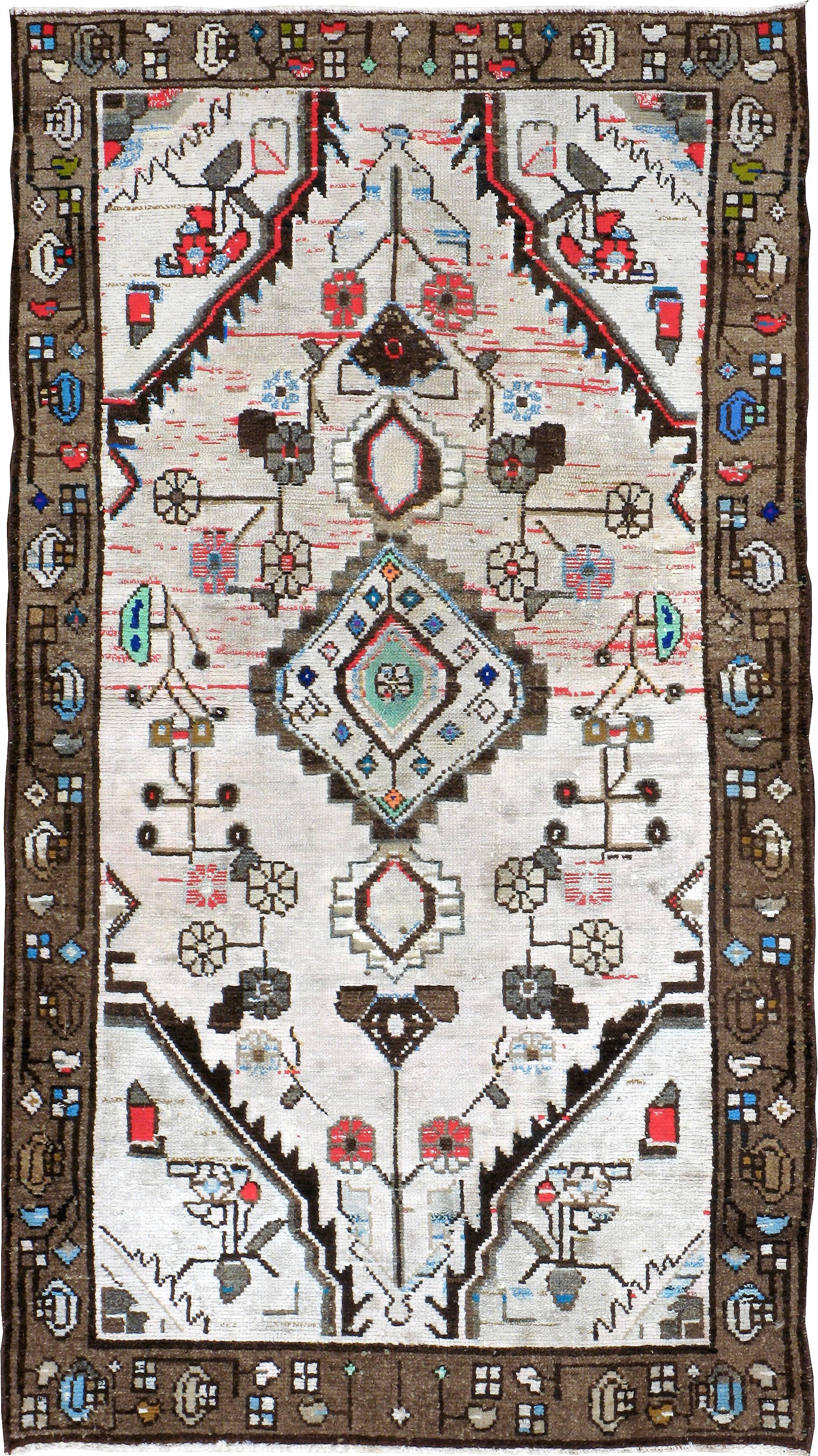 A vintage Persian Hamadan carpet from the second quarter of the 20th century with cotton highlights.

Measures: 2' 8