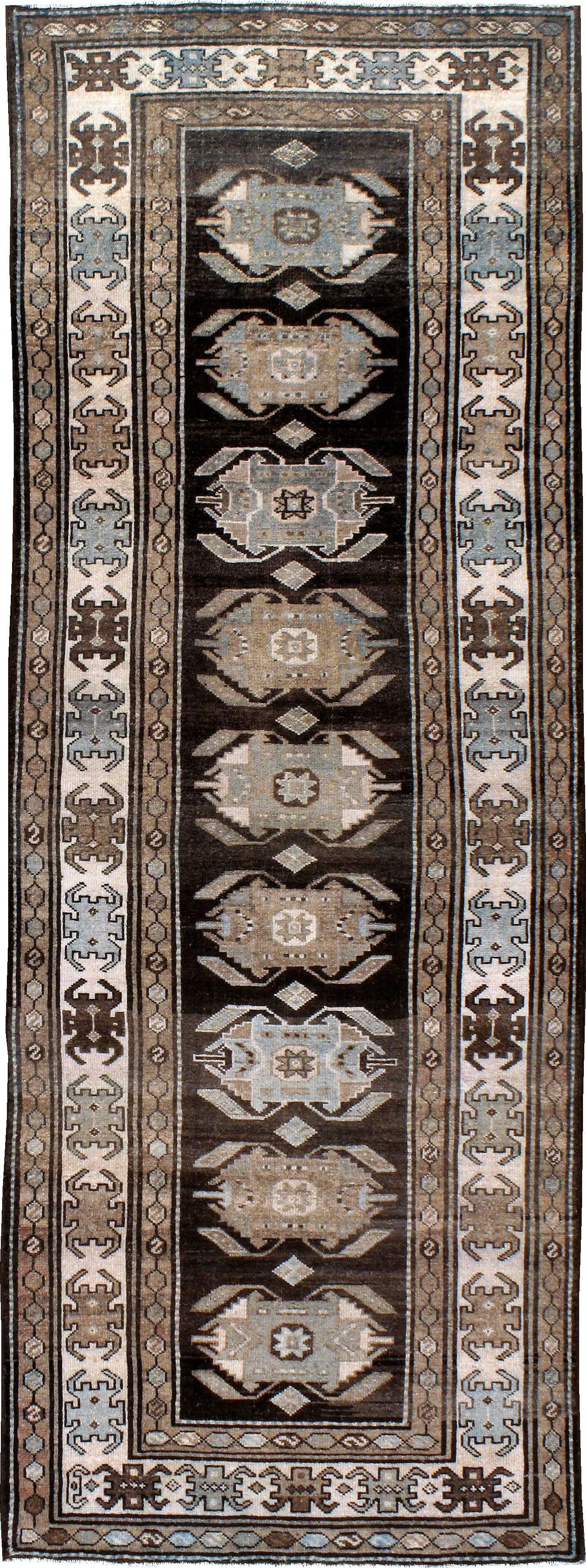 An antique Persian Kurd rug from the first quarter of the 20th century.