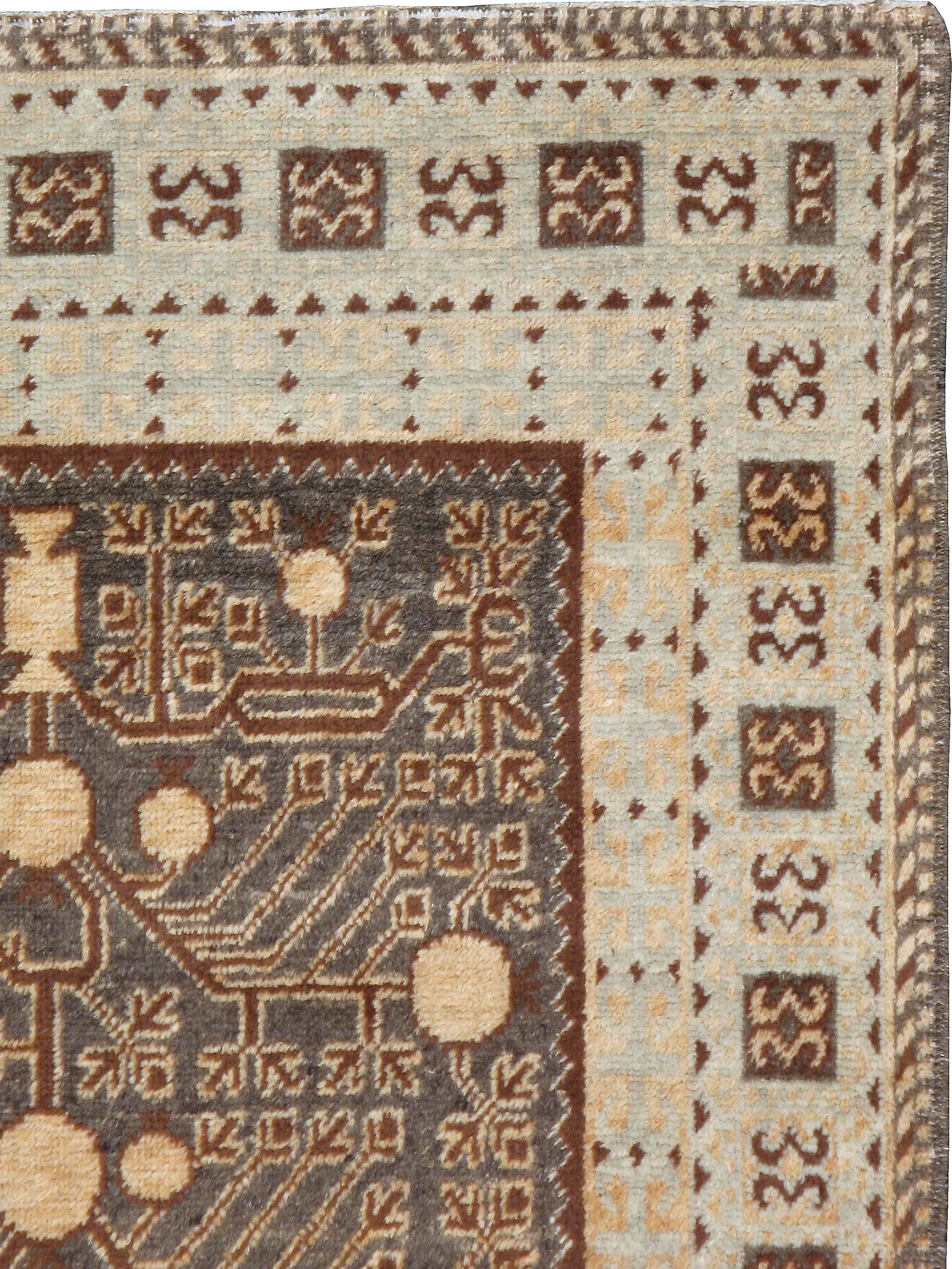 An antique East Turkestan Khotan carpet from the second quarter of the 20th century.