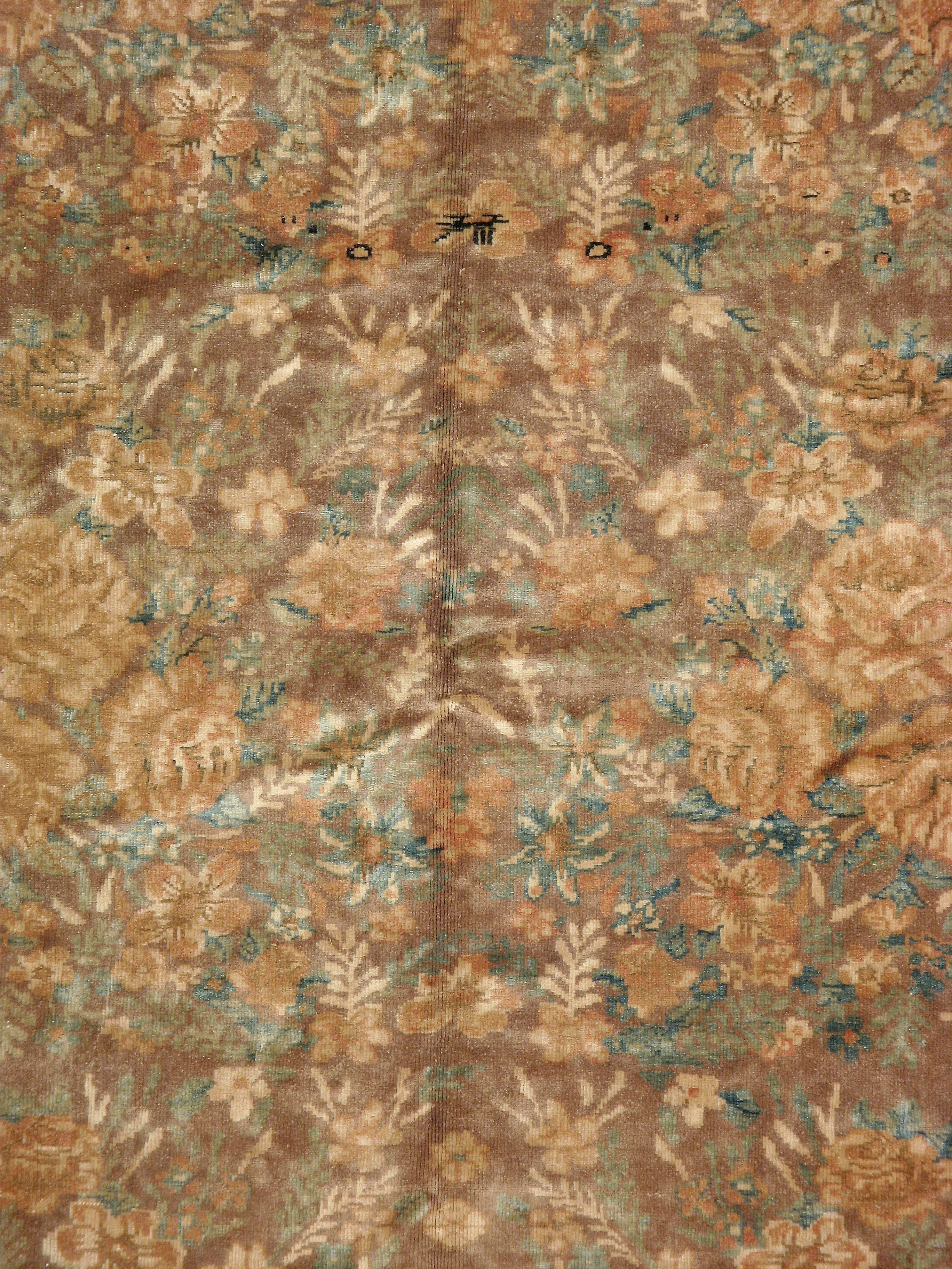 A vintage Russian Karabagh carpet from the second quarter of the 20th century with an elegant horror vacui floral pattern.