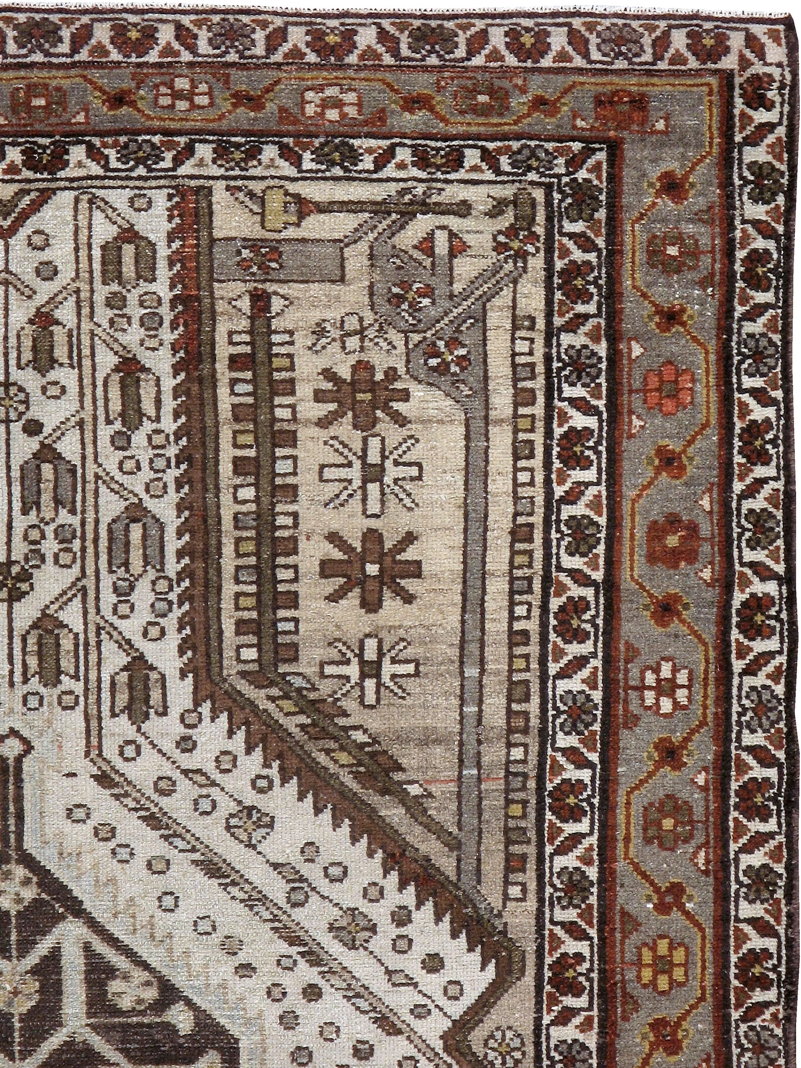 An antique Persian Malayer carpet from the first quarter of the 20th century.