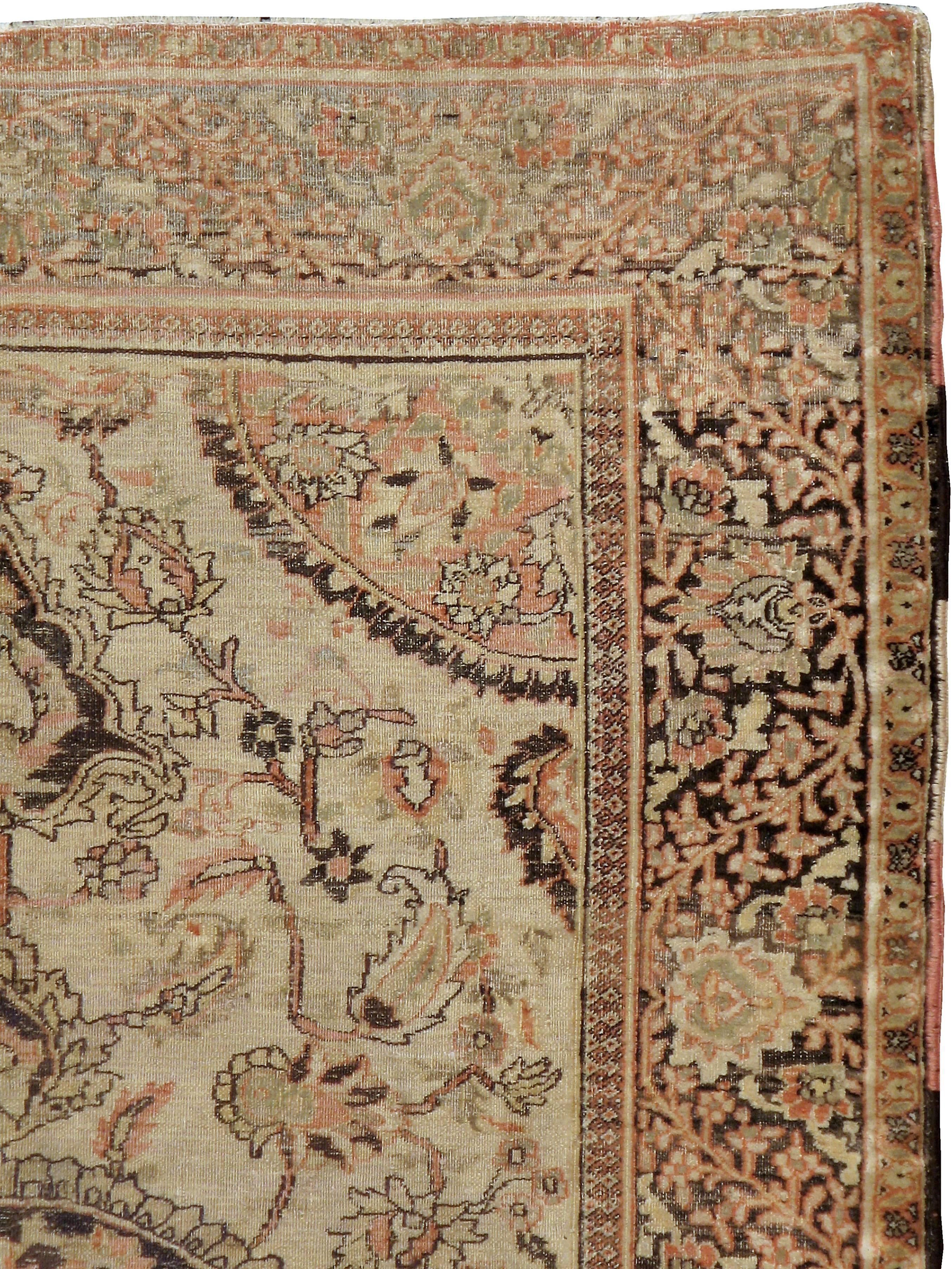 An antique Persian Dorokhsh carpet from the first quarter of the 20th century.