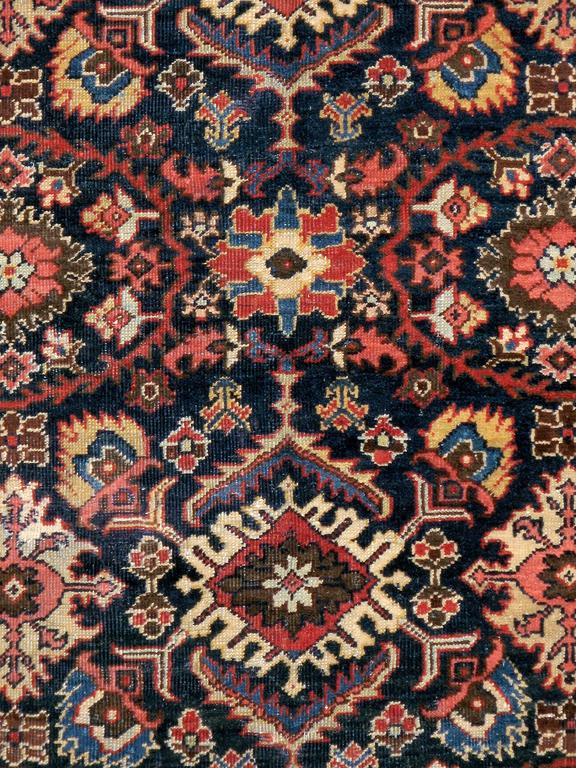 An antique Persian Mahal carpet from the first quarter of the 20th century.