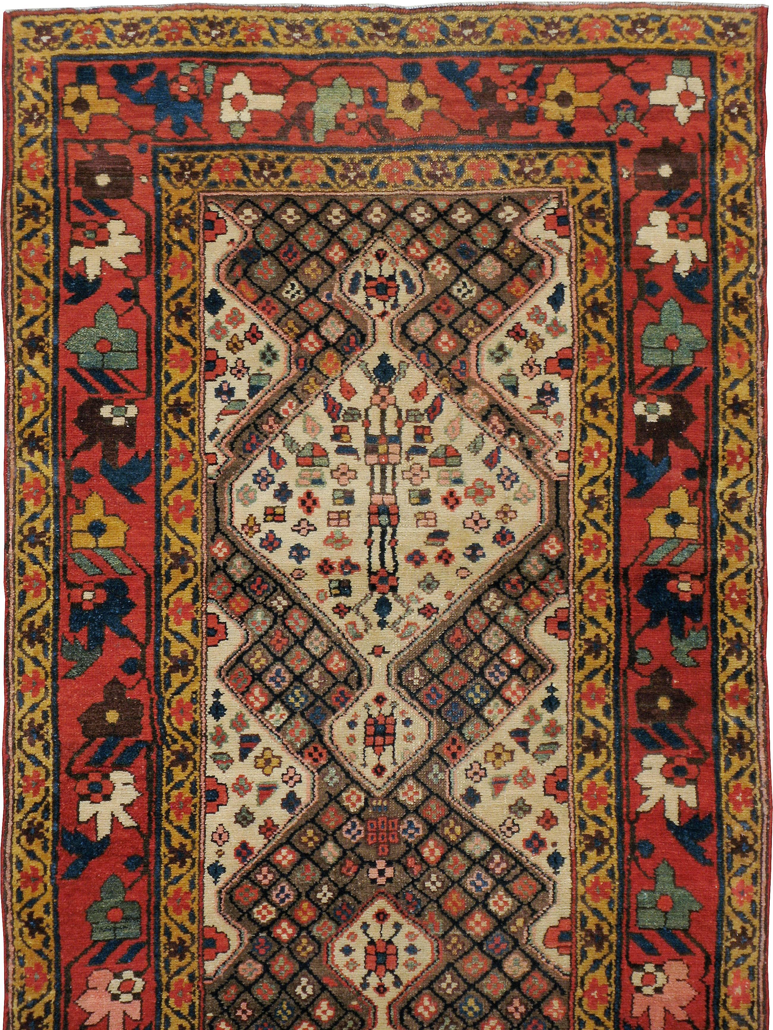 An antique Persian North West rug from the first quarter of the 20th century.