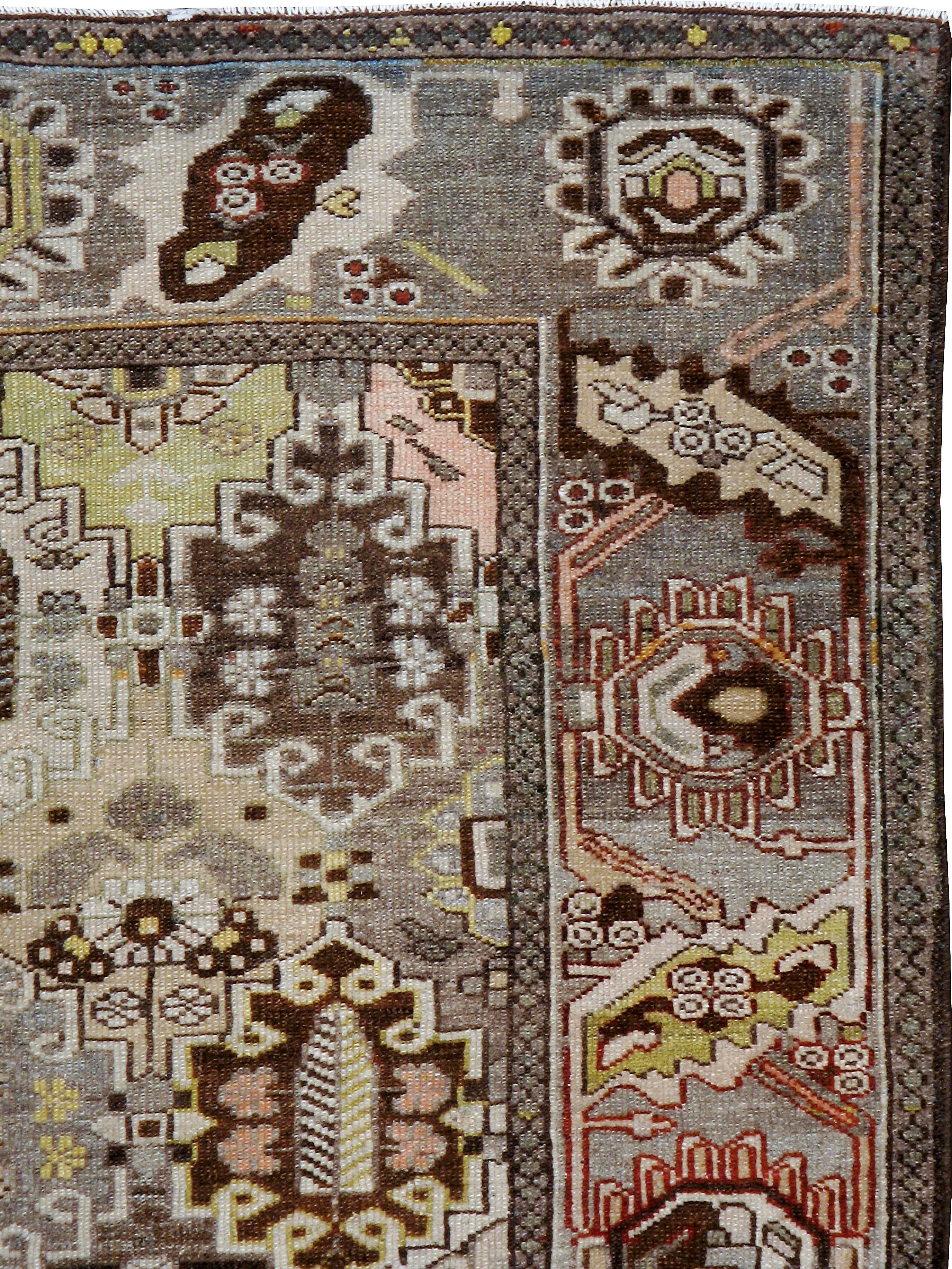 An antique Persian Bakhtiari carpet from the first quarter of the 20th century.