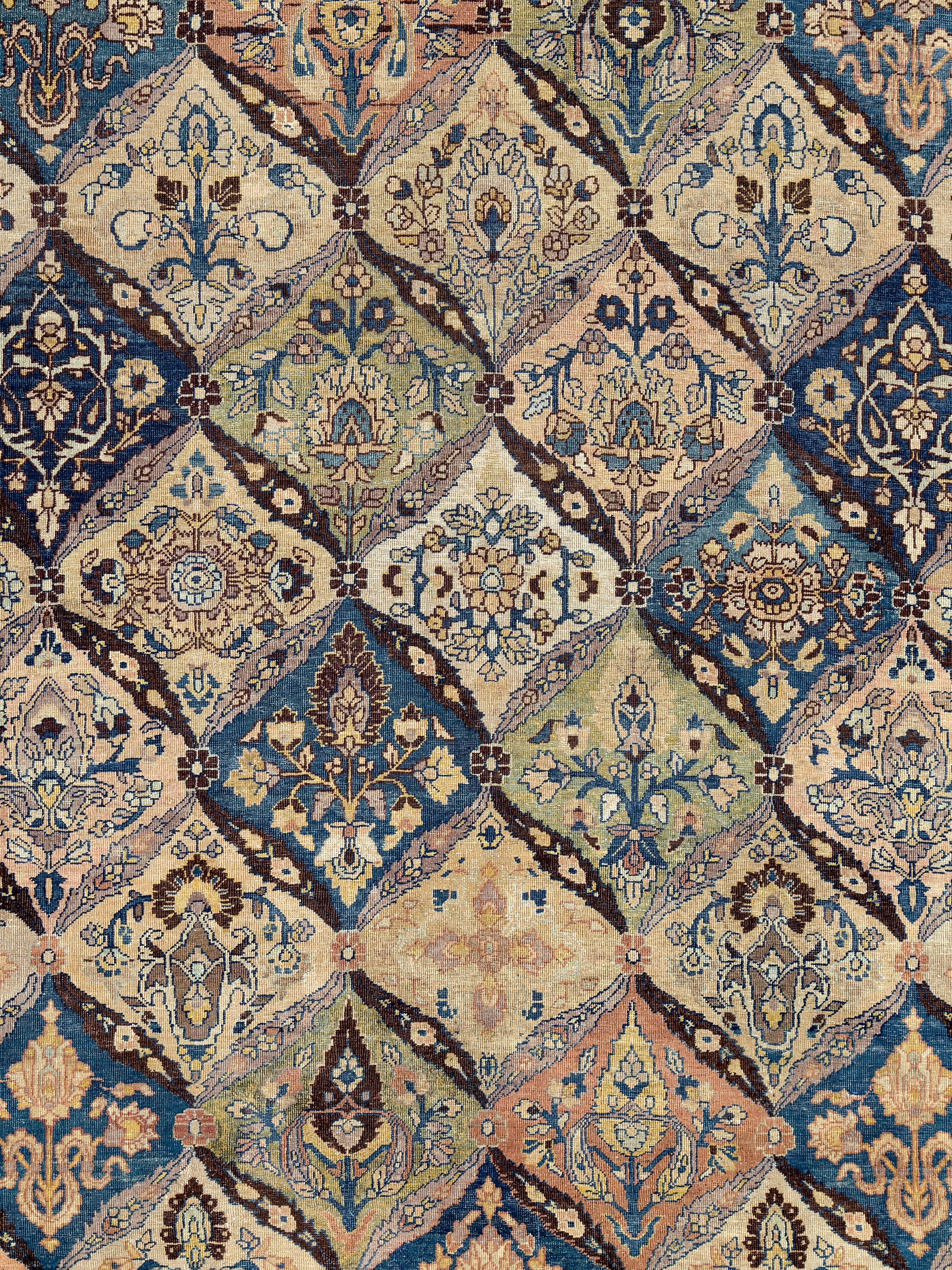 An antique Persian Tabriz rug from the early 20th century with a multicolored garden design.