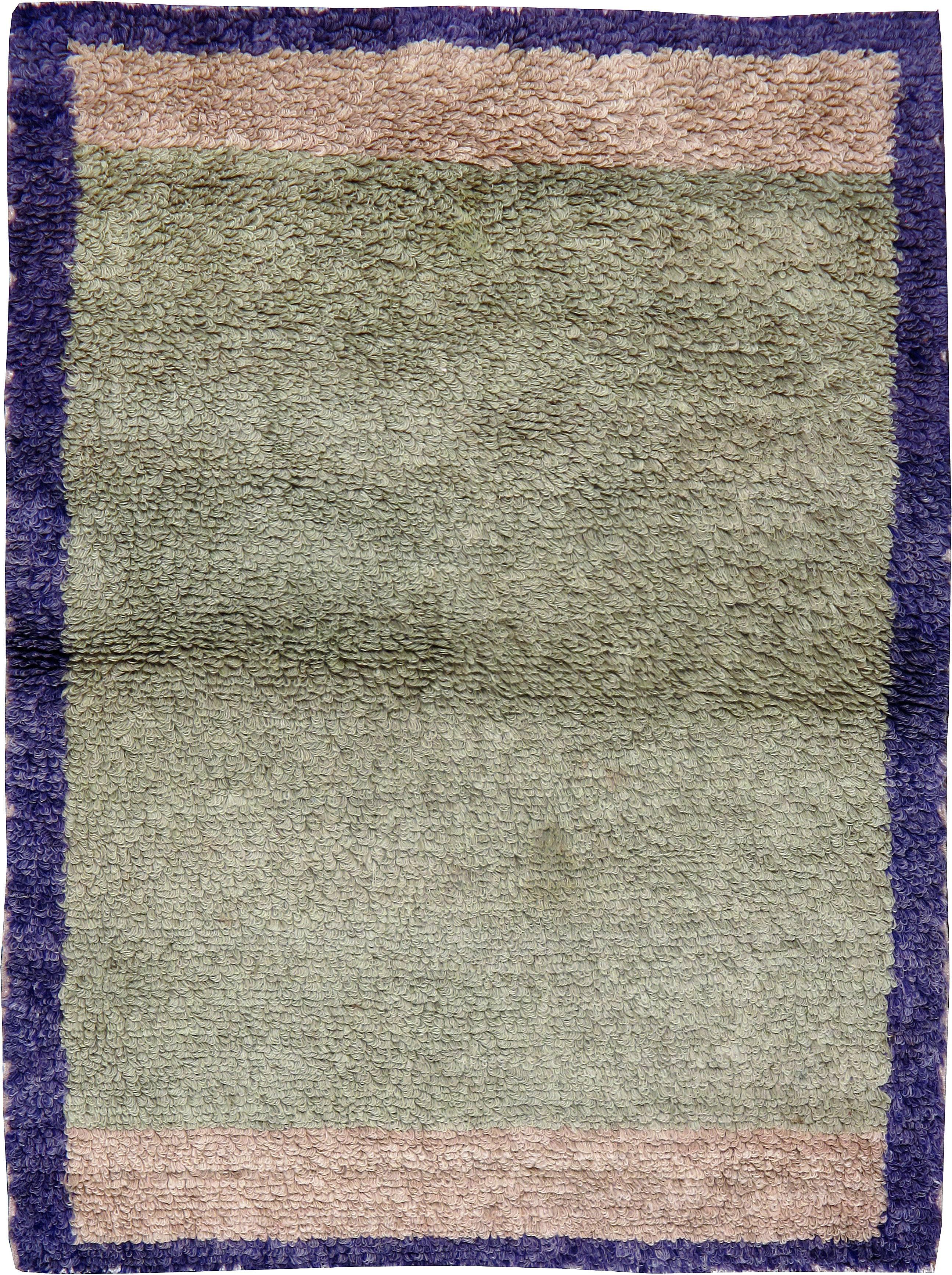A vintage Turkish Konia carpet with mint and purple hues from the mid-20th century.