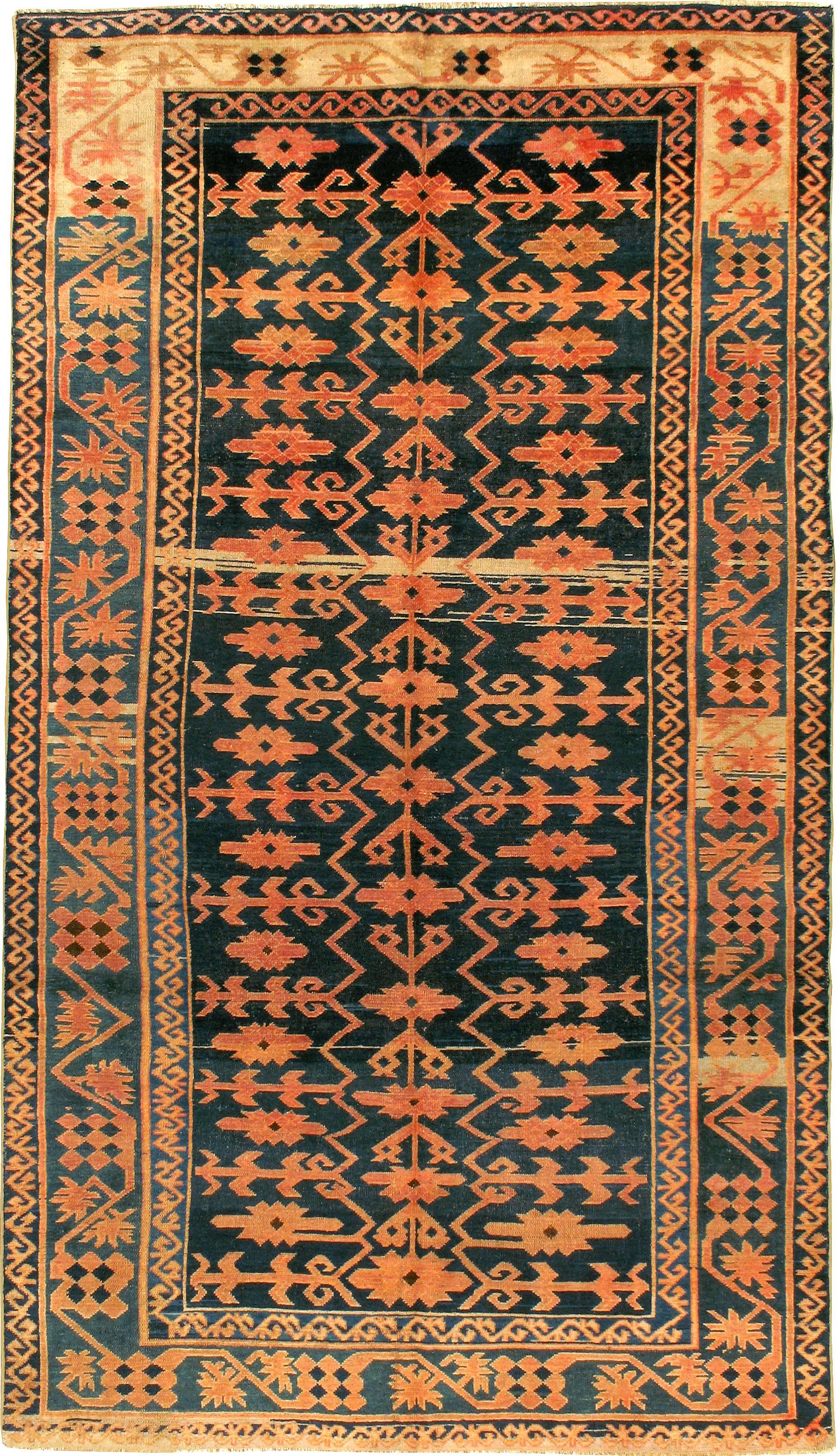 An antique East Turkestan Kirghiz carpet from the turn of the 20th century.