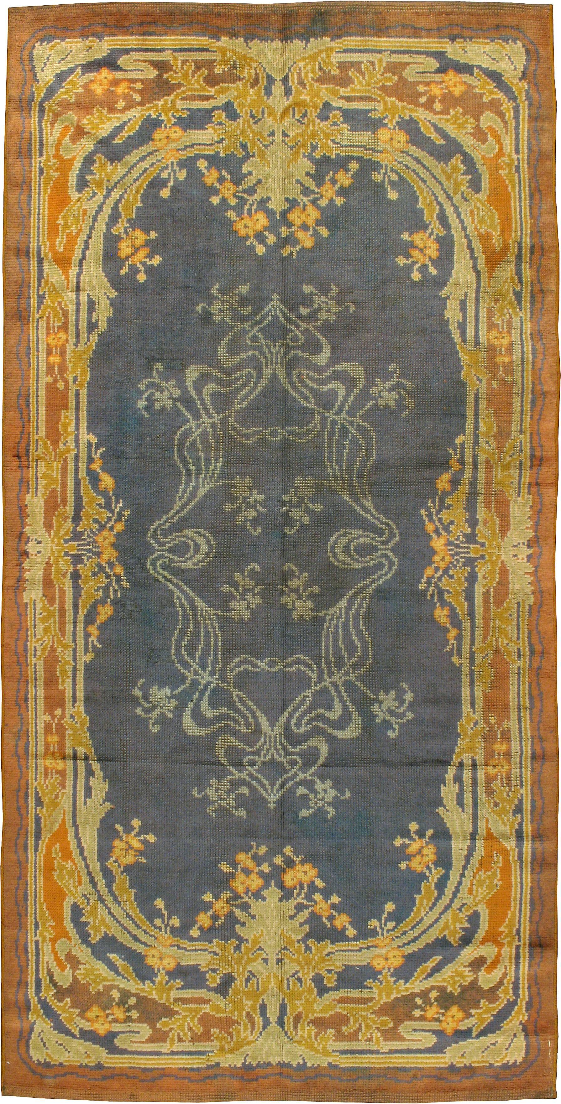 An antique European Donegal carpet from the second quarter of the 20th century.