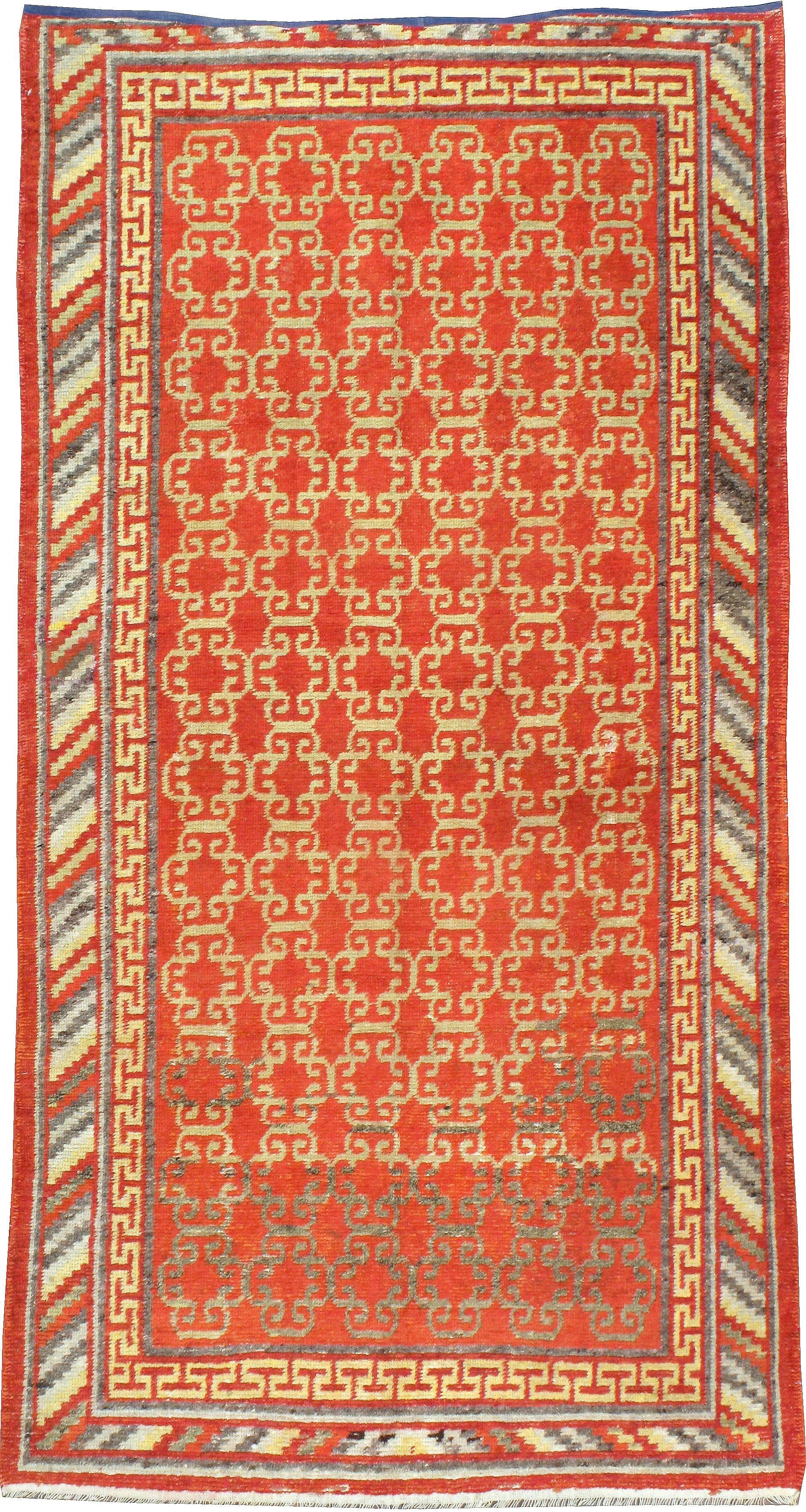 An antique East Turkestan Khotan carpet from the turn of the 20th century.