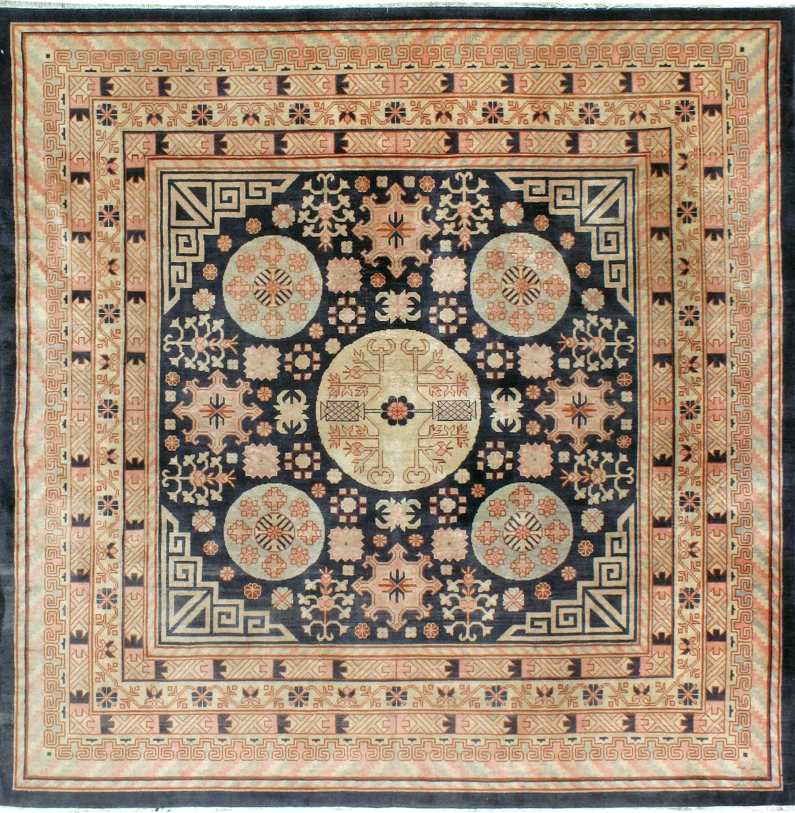 An early 20th century East Turkestan Khotan carpet. Antique Khotan rugs and carpets were produced in the oasis town of Eastern Turkestan, today part of the Xinjiang region in Western China. This area has had a steady production of carpets since the