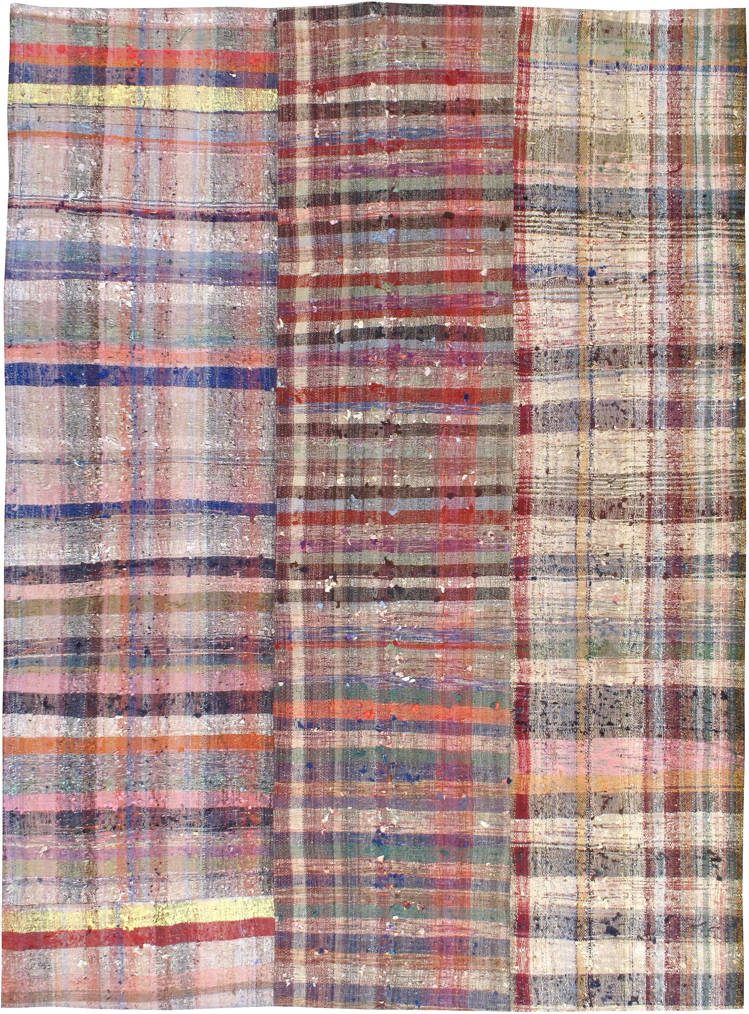 A Turkish flat-woven Kilim style carpet fabricated and pieced together in the 21st century using vintage carpets from the second quarter of the 20th century. 